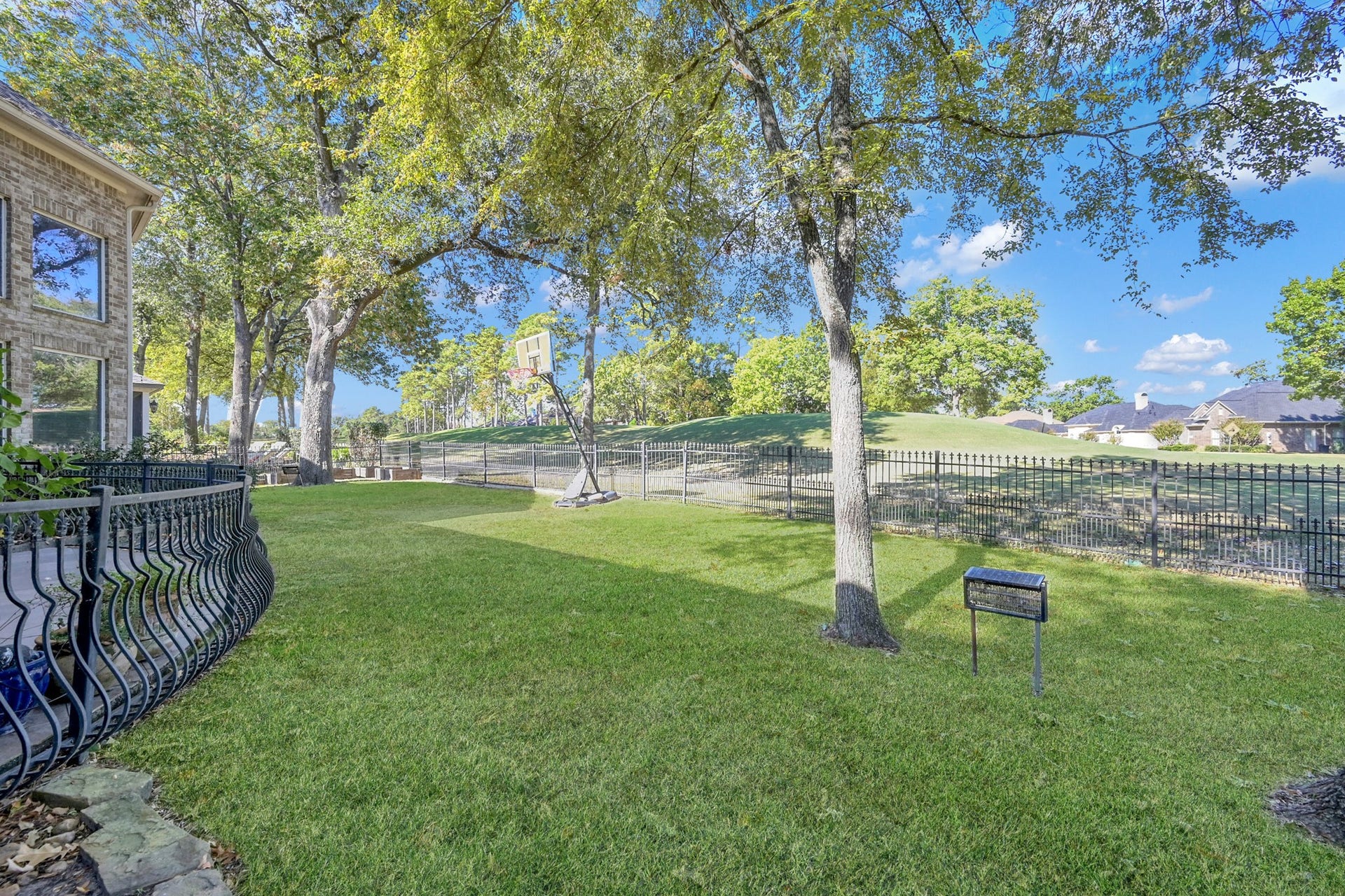 79 Melrose Drive, Montgomery, TX 77356 Backyard with a view of the Weiskopf hole 7 tee boxes.