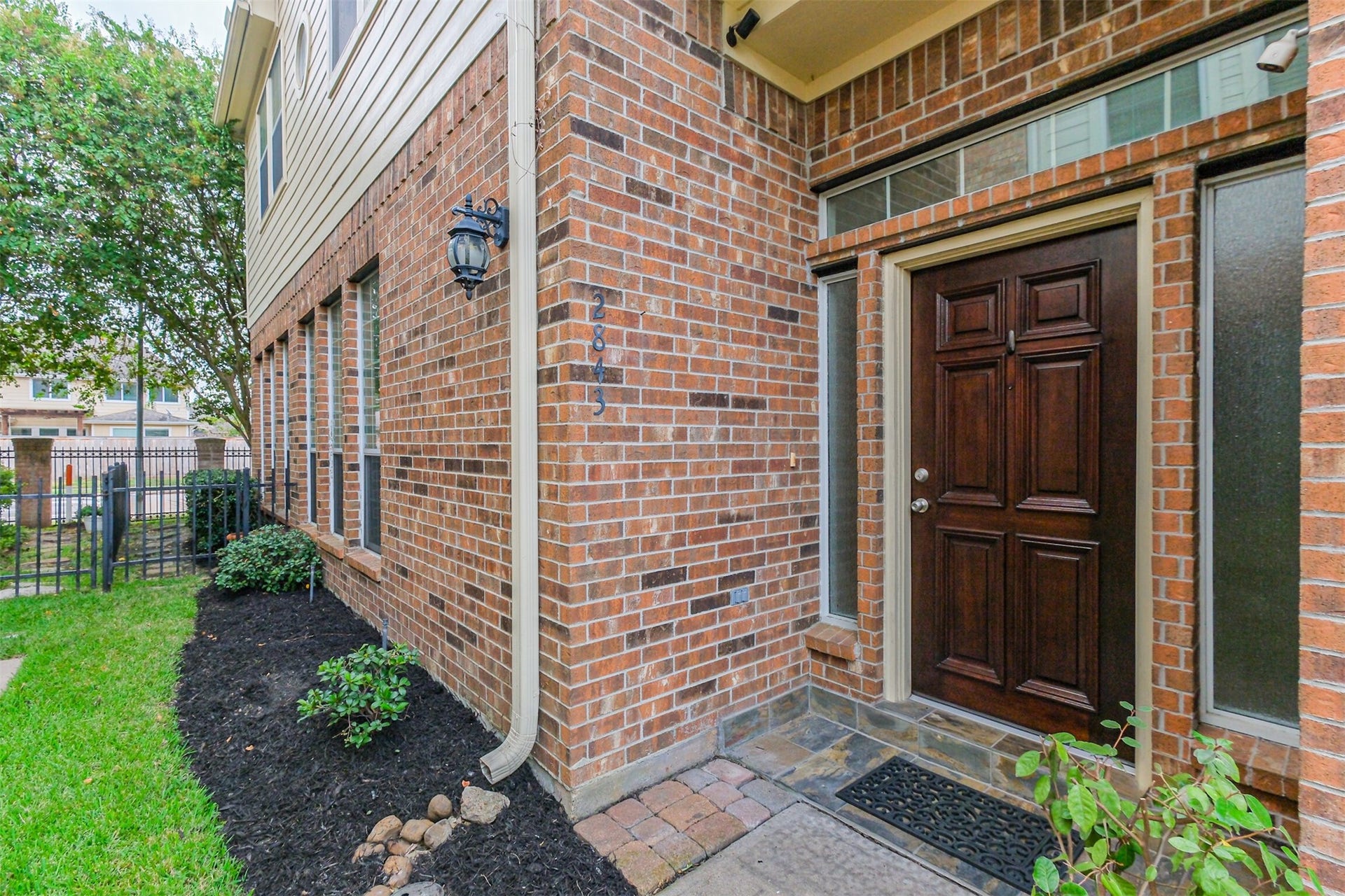 2843 Misty Heath Lane, Houston, TX 77082 Welcome home! The entrance is located on the side of home with fresh mulch and a solid wood door.