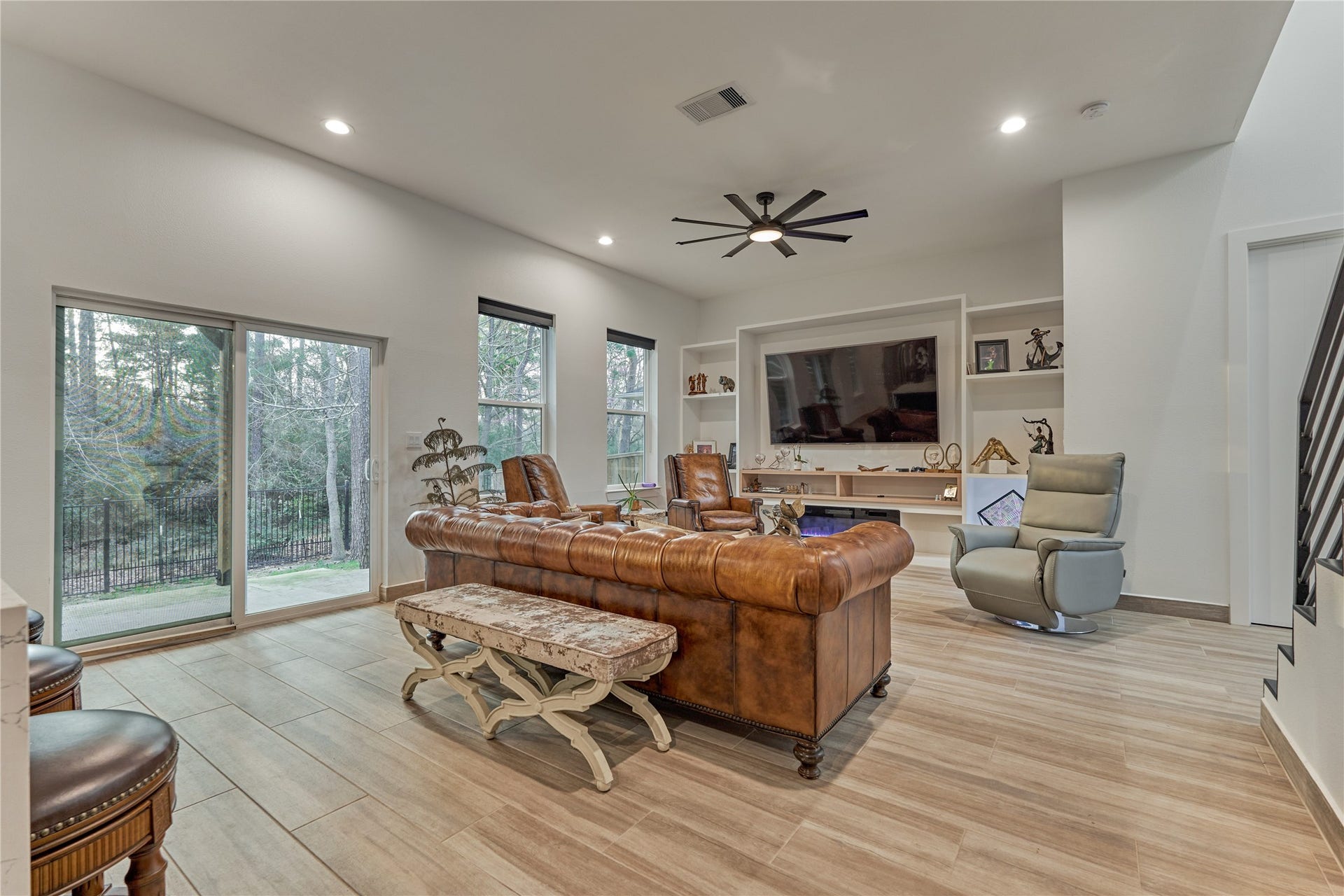 Sliding doors lead to the patio, creating effortless indoor-outdoor entertaining.