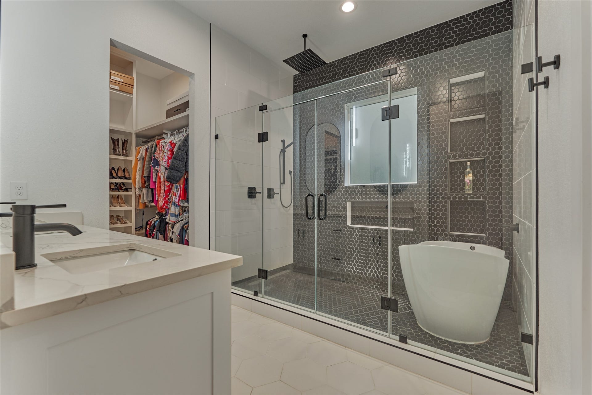 Indulge in your private spa-like ensuite bath, featuring a luxurious soaker tub for total relaxation and a luxurious shower with a soothing rain shower head.