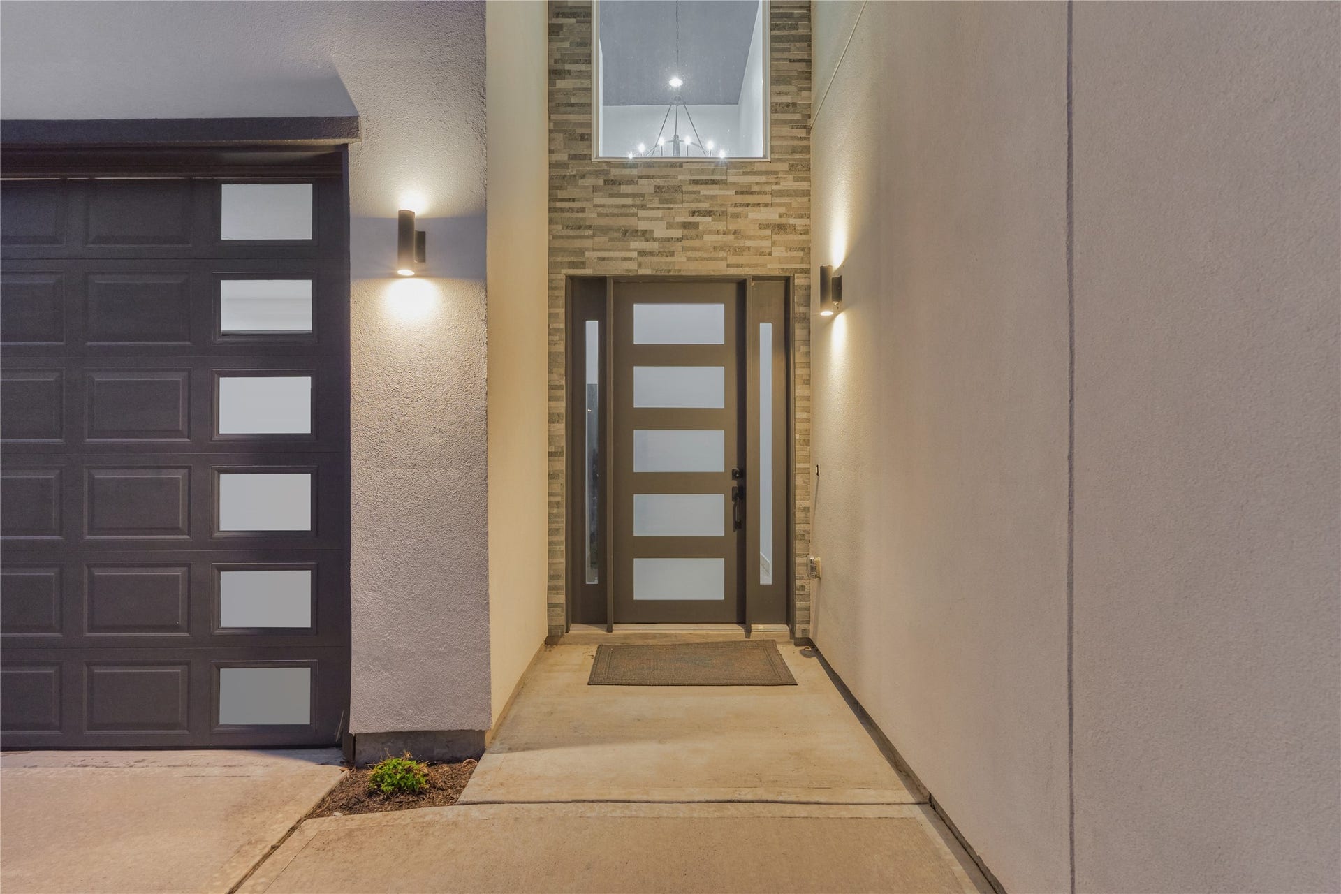 An elegant stucco faade, highlighted by a stone-accented entry, warmly welcomes you inside.