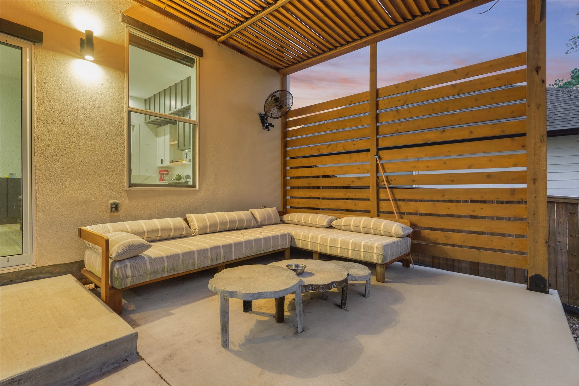Enjoy your morning coffee on the pergola-covered back patio - perfect for al fresco breakfasts or quiet reading.