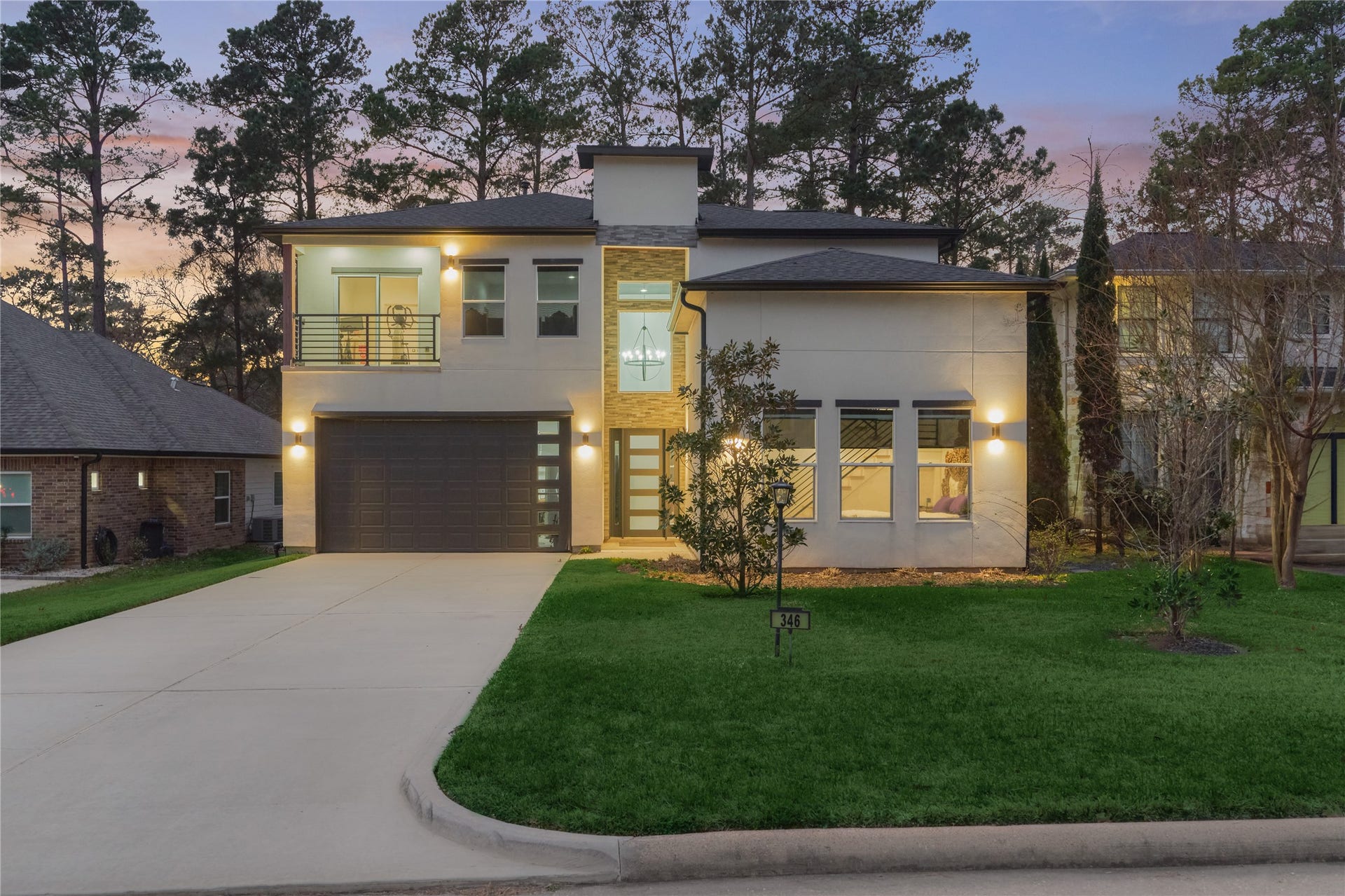 The long double-car driveway offers ample guest parking, leading to a spacious 2-car garage.