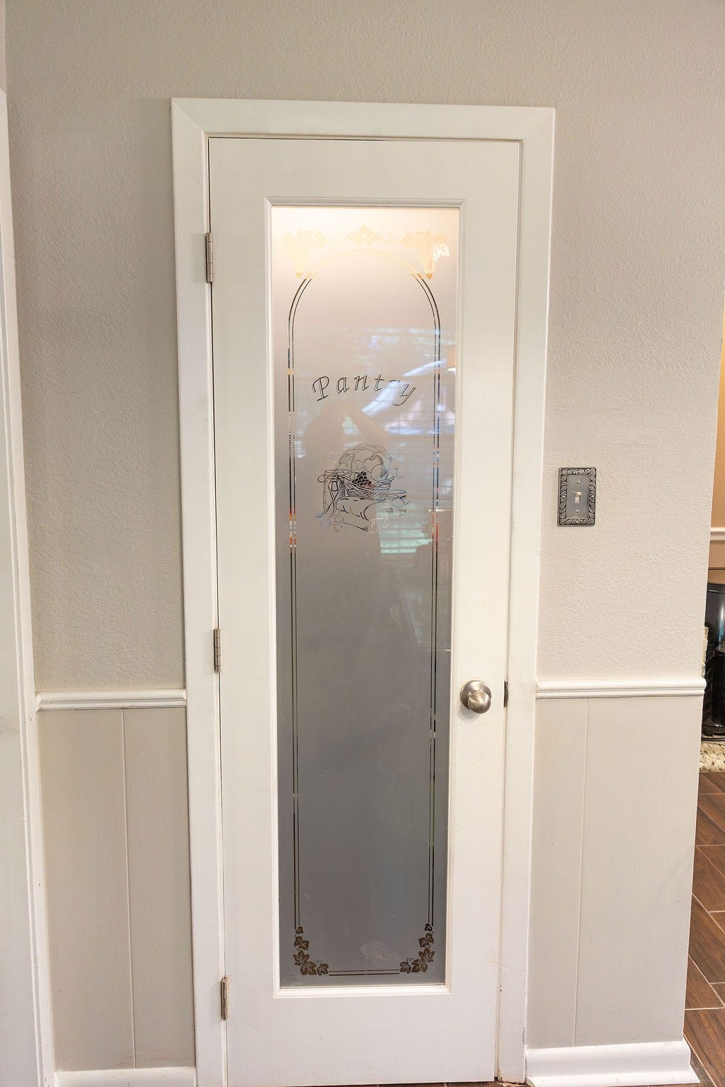 1314 Laurel Street, La Marque, TX 77568 What a stylish touch! The frosted glass pantry door adds character and charm while offering a modern, elegant look that complements the kitchen beautifully.