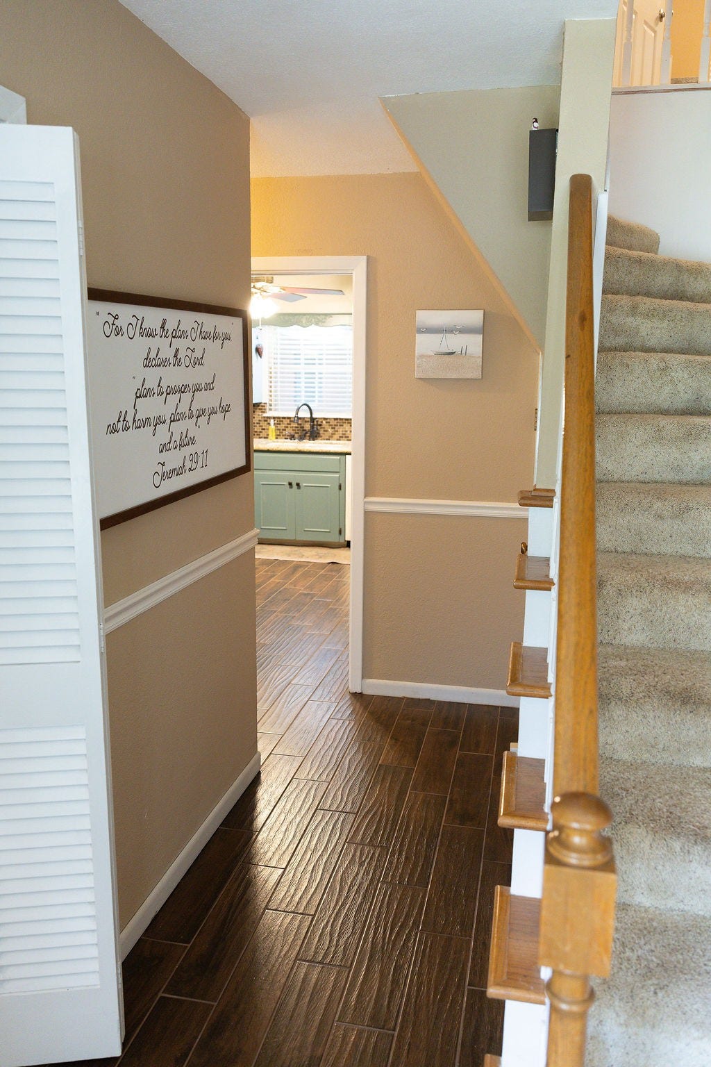 1314 Laurel Street, La Marque, TX 77568 Step into a beautiful entryway that showcases the elegant spindle staircase and welcomes you with an open, inviting layout. From the foyer, you'll enjoy views into the kitchen, family room, and a gorgeous private study, creating a warm and impressive first impression.