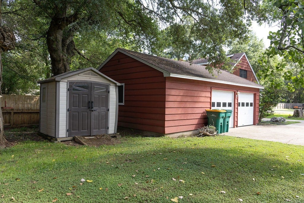 1314 Laurel Street, La Marque, TX 77568 Keep your lawn equipment, gardening tools, and seasonal items neatly stored in the backyard storage shed, leaving your oversized garage free for a workshop, hobbies, or additional storage.