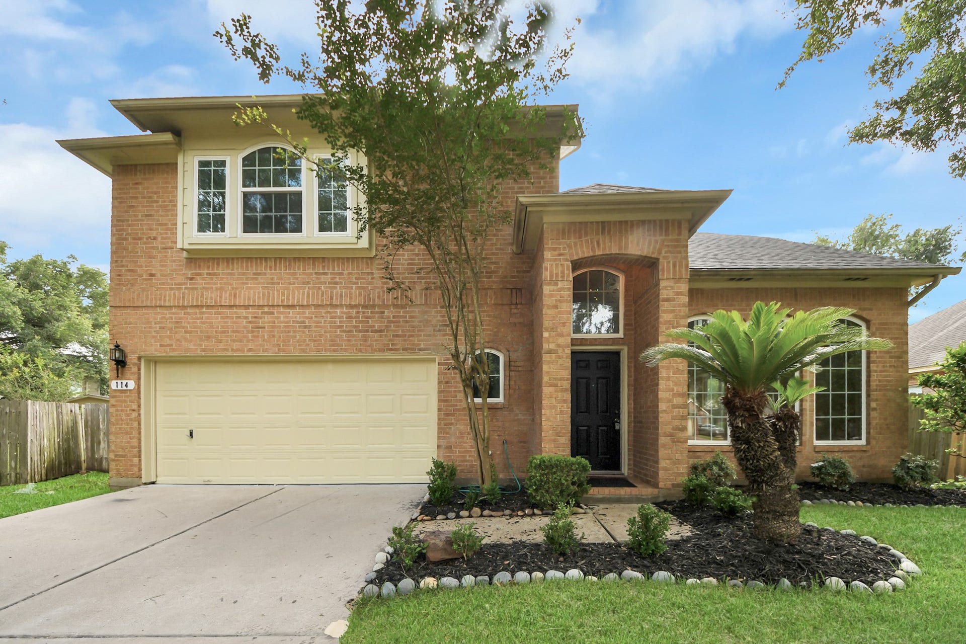114 Lindencrest Court, Sugar Land, TX 77479 Primary: Stunning two-story home with charming curb appeal, manicured landscaping, and a welcoming entrance.