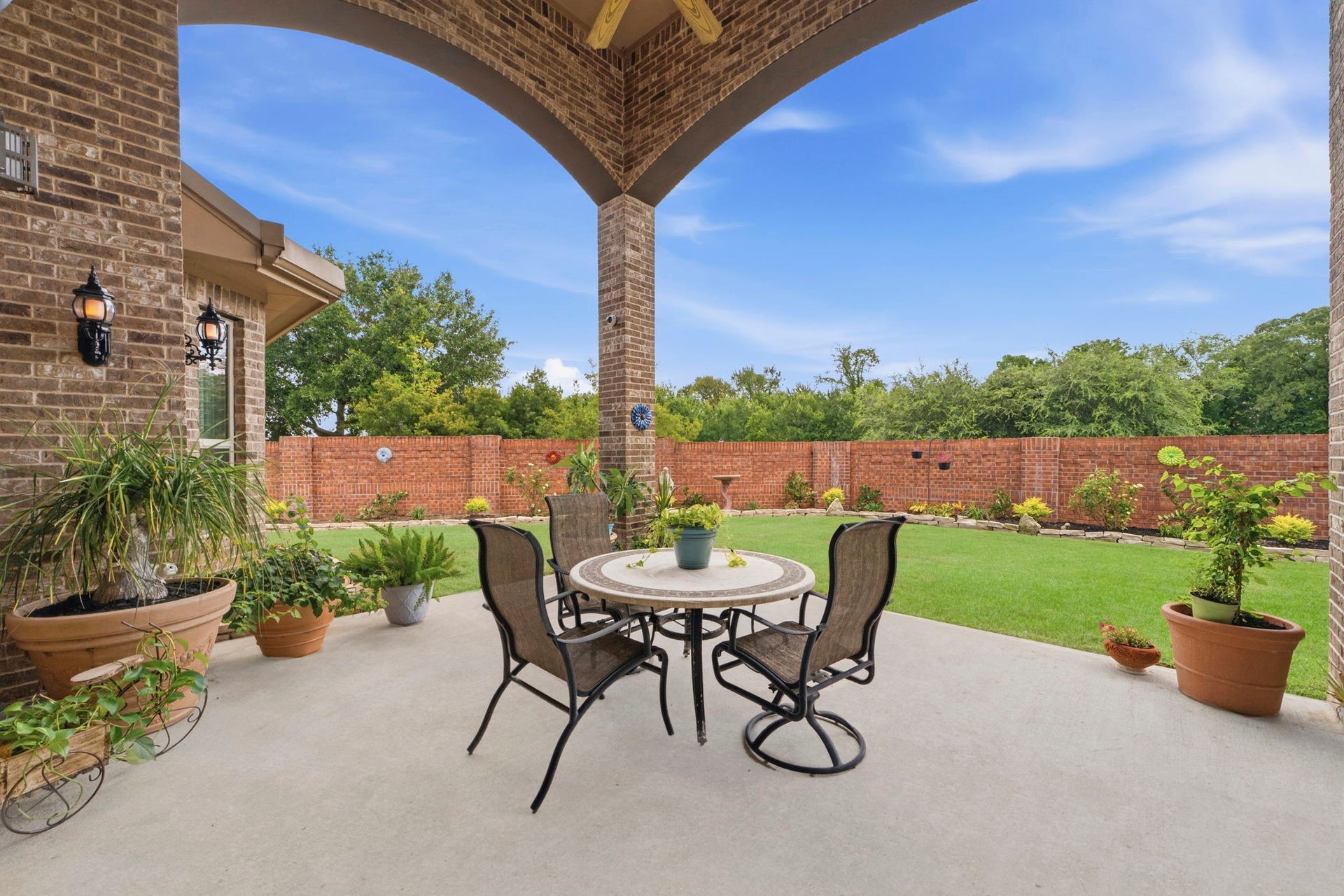 Beautiful Brick wall for added privacy and no back neighbors! Enjoy an extended covered patio and outdoor Kitchen.