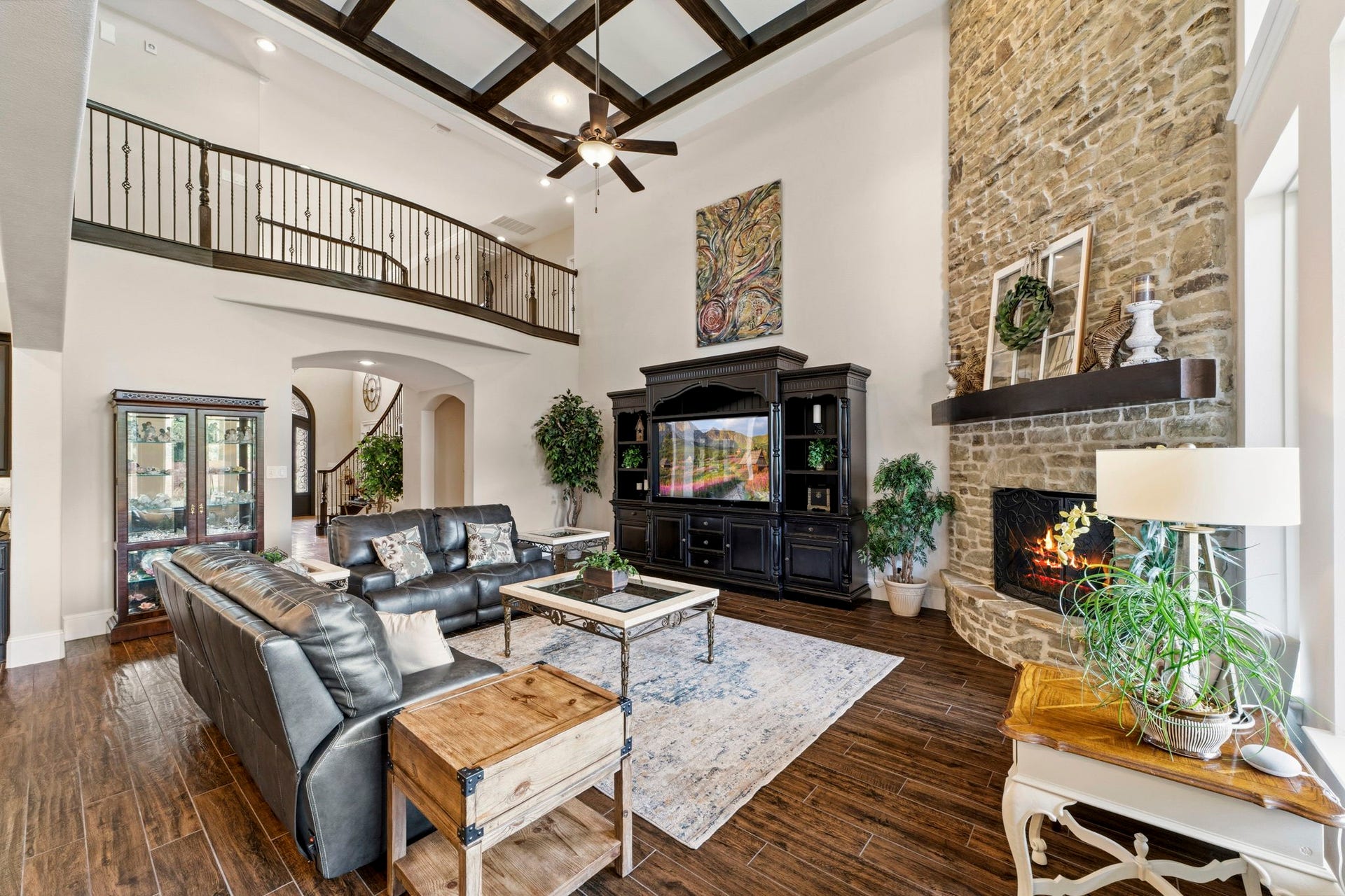 Grand Living Room with a stone fireplace that reached the coffered ceiling!