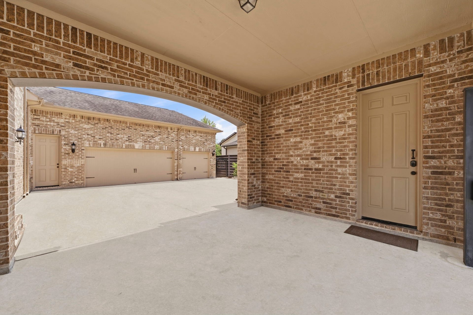 Porte-cochere connects to the 4th garage bay and beyond the porte-cochere is plenty of space for parking along with the attached 3-car garage!