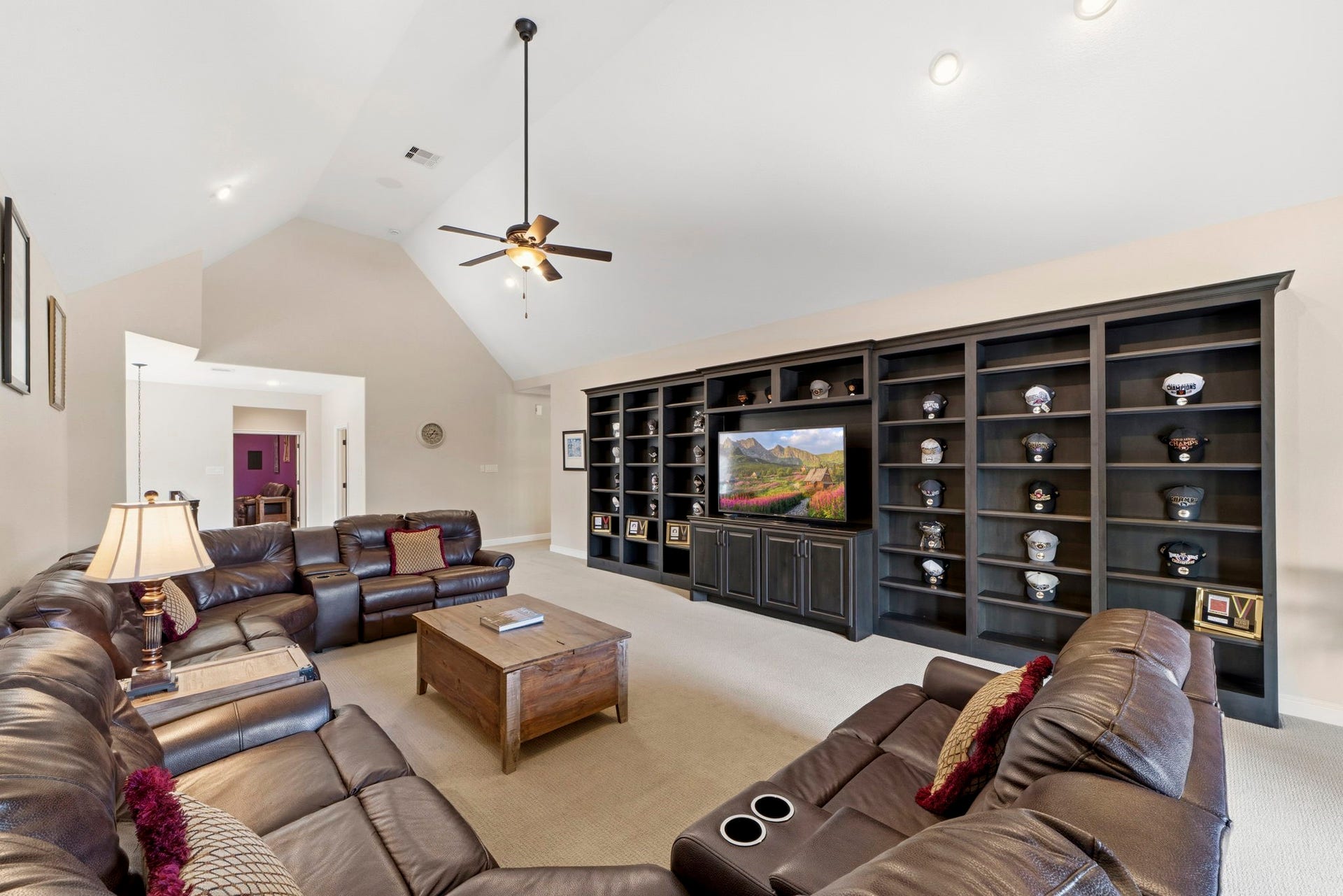 Another area that was thoughtfully customized to extend the square footage was the upstairs Gameroom! Plenty of room for large families and/or large parties. Also beautiful custom shelves