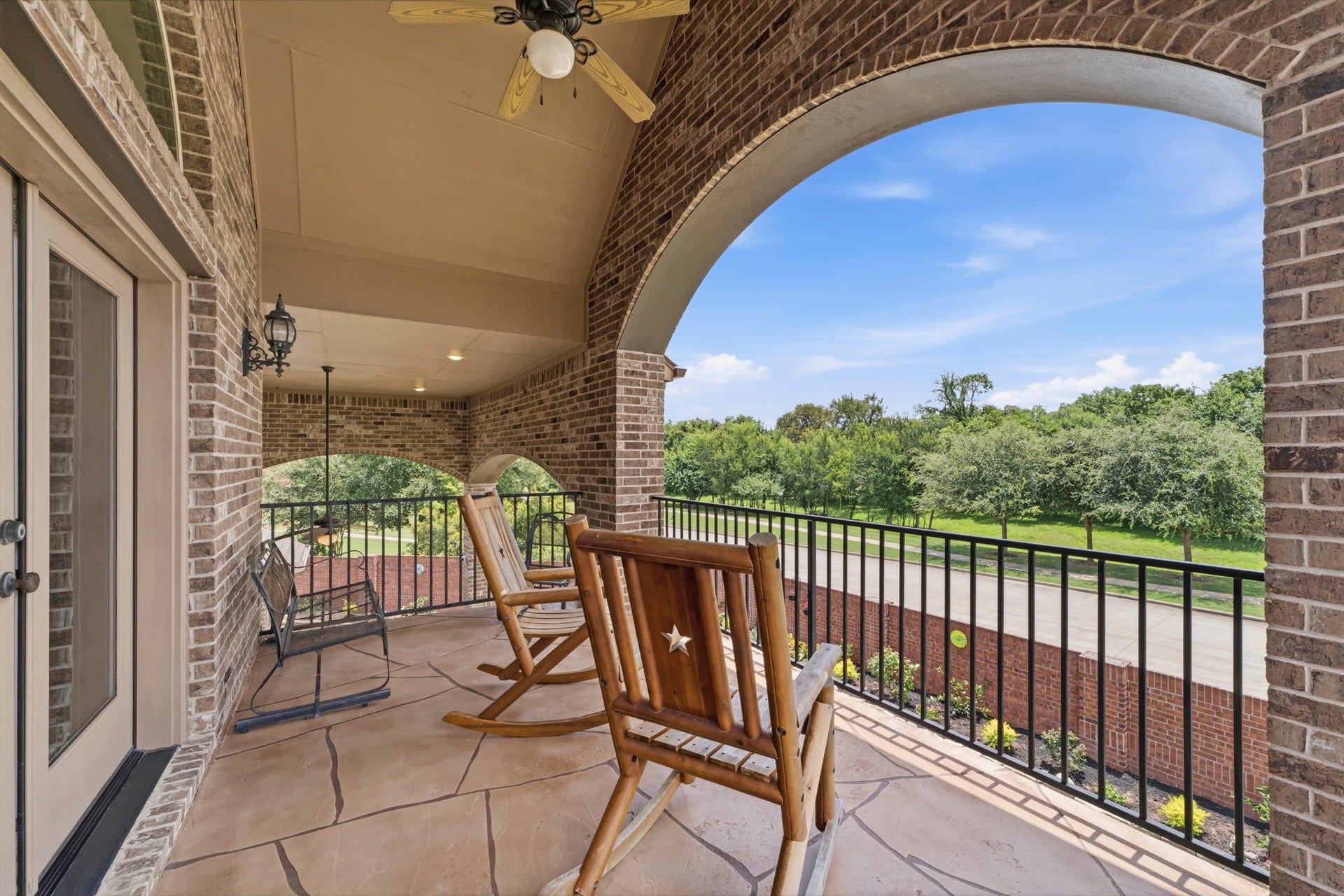 The Loggia off of the Gameroom faces lush trees and no back neighbors!