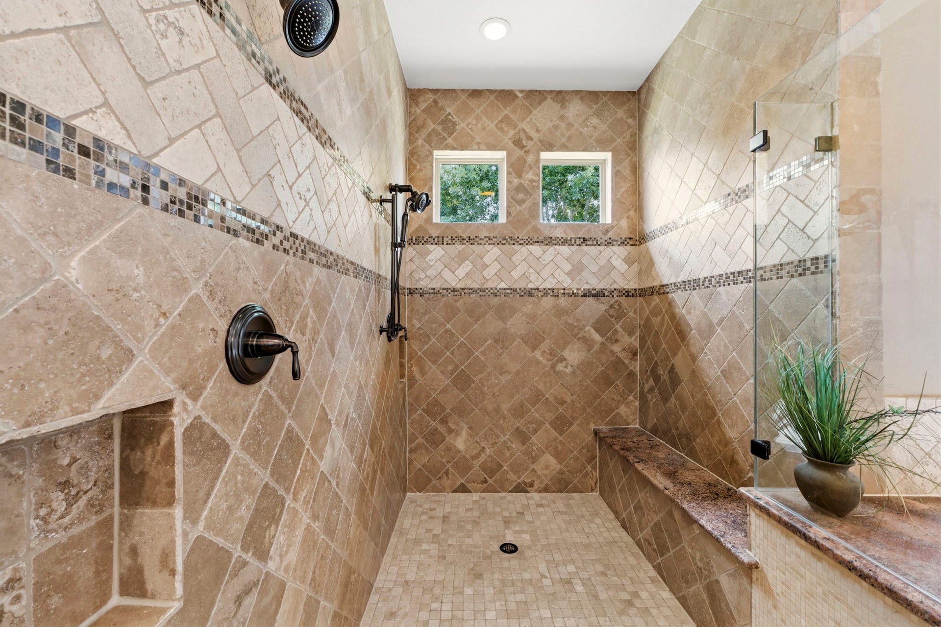 Oversized shower with two shower heads and natural light!