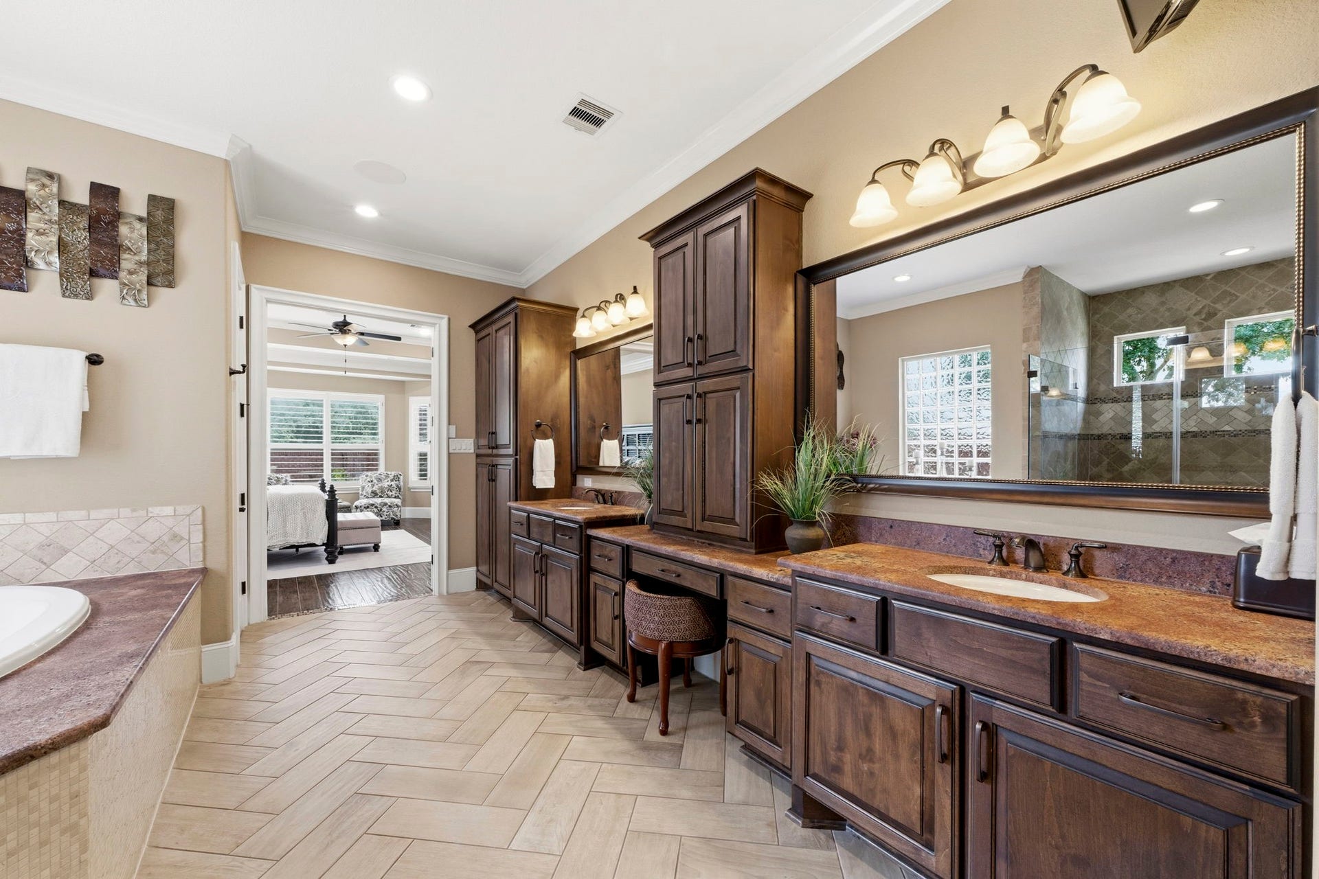 You will never want to leave this spacious Primary Bath with an oversized shower, soaking tub, and a unique upgraded granite that is sure to impress!