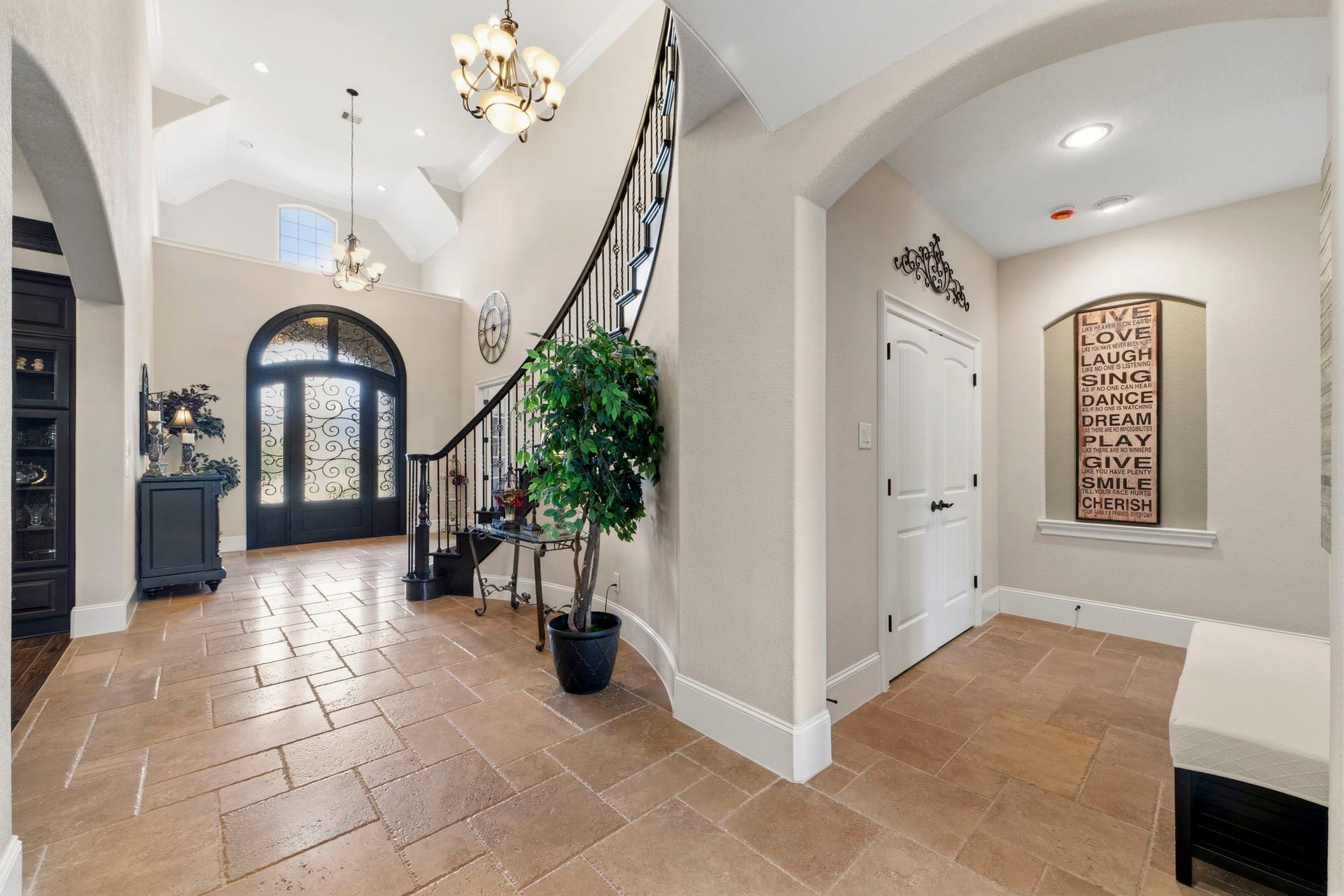 The hallway into the primary Bedroom shown here is located just off of the entry way