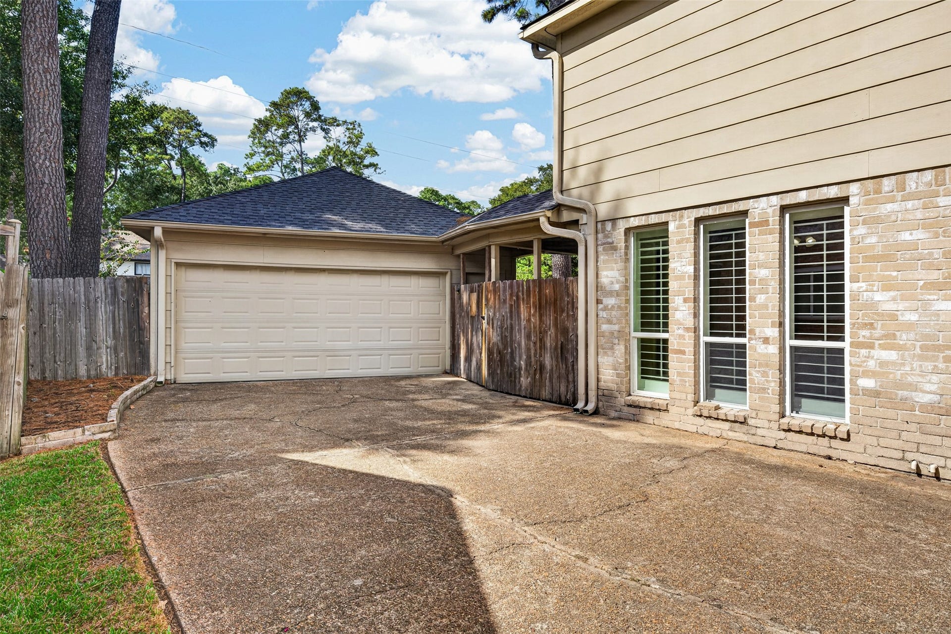 6206 Willow Pine Drive, Spring, TX 77379 The long driveway is a perfect extra space for the kiddos to play, or for your home projects and leads to a two-car detached garage.