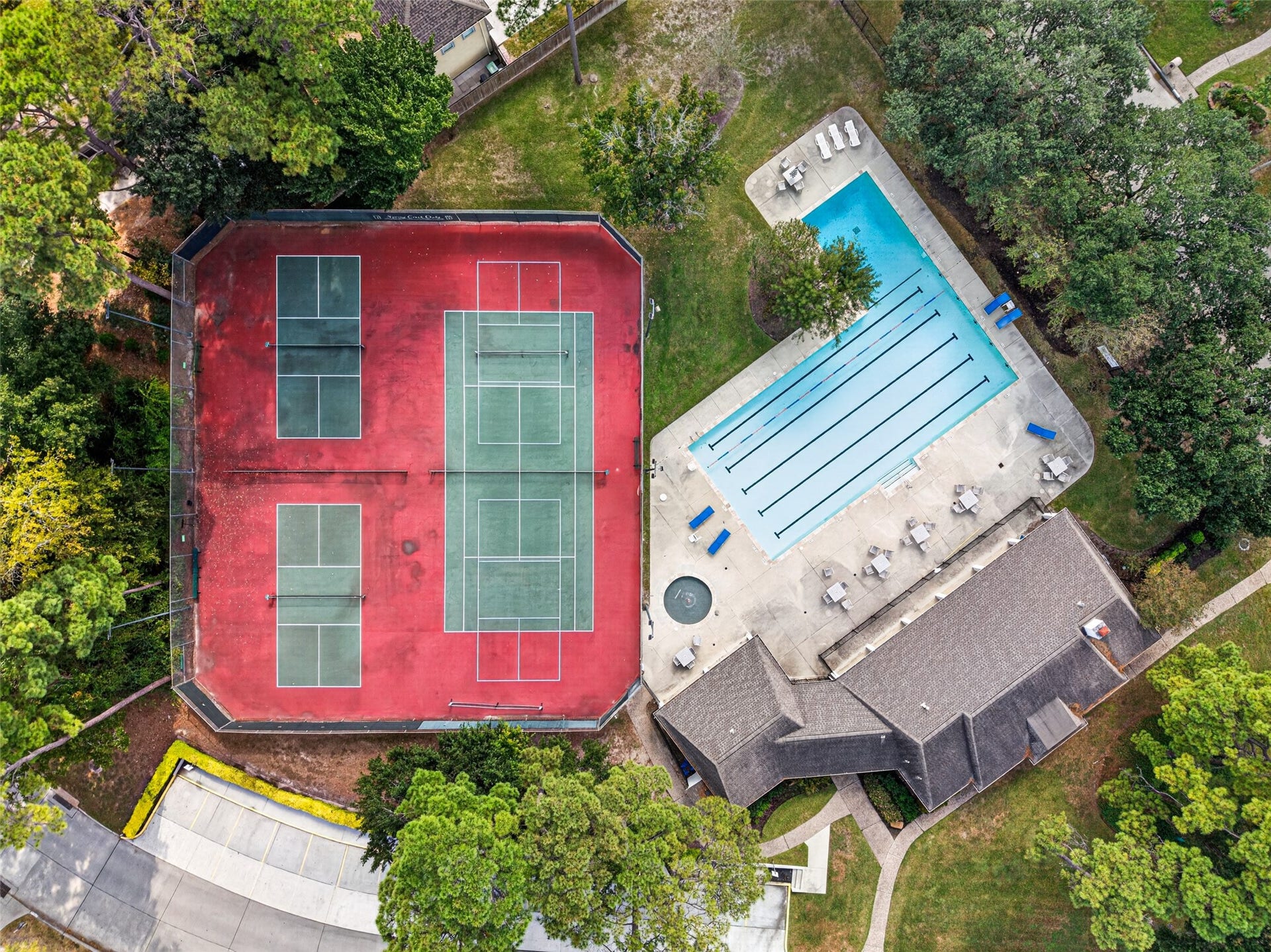 6206 Willow Pine Drive, Spring, TX 77379 Pickle ball and tennis courts, an olympic sized pool as well as a wading pool for the little ones are available to you year around.
