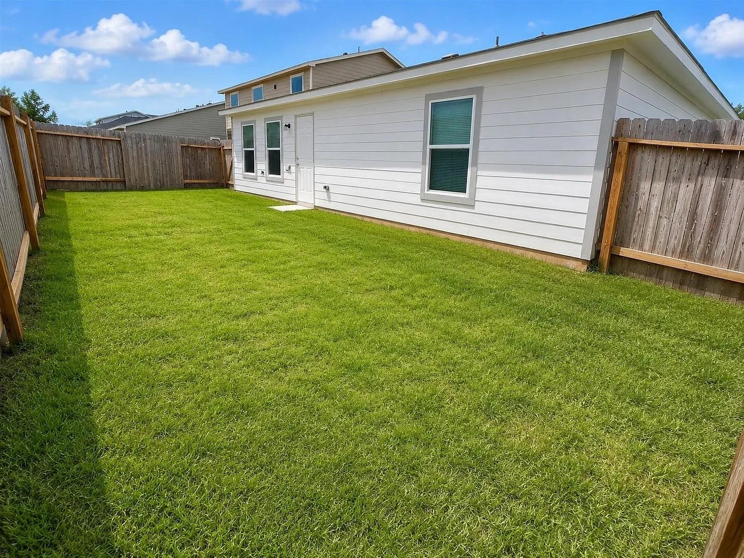 fenced backyard; push mower included