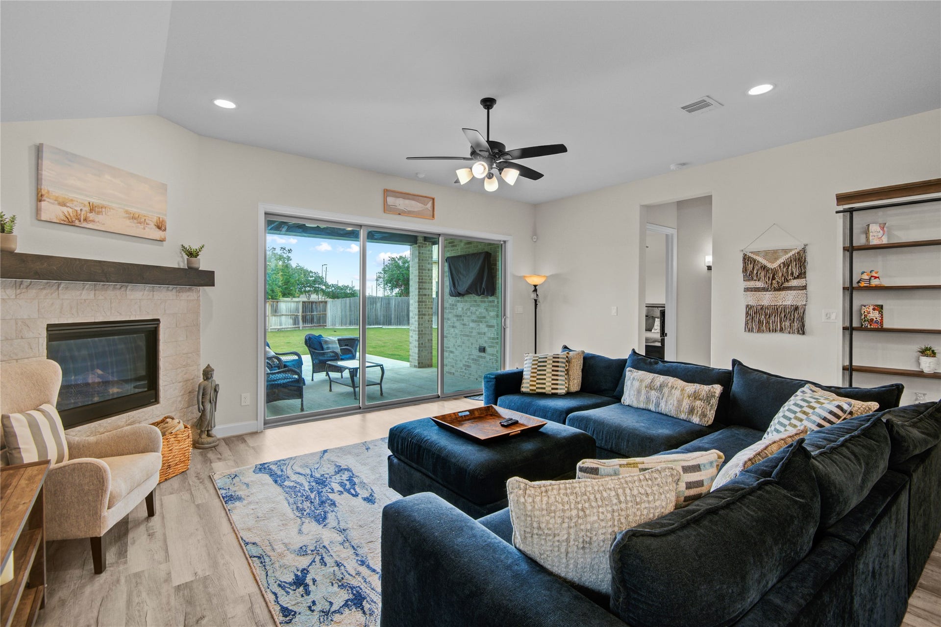 10834 Capella Creek Way, Richmond, TX 77406 Family Room overlooking the Covered Patio - Expansive Sliding Patio Doors open to connect the family room to the outdoor space