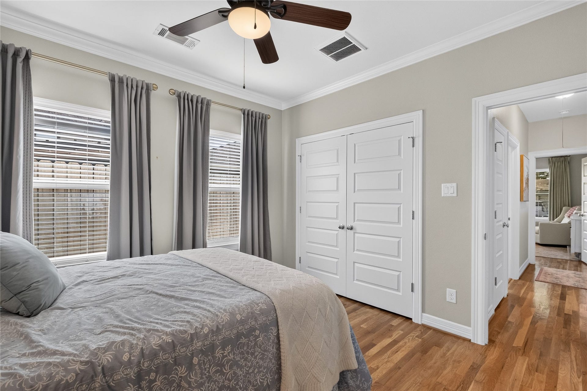 The third bedroom with double doors leads to a spacious closet, while an adjoining hallway guides you to additional living areas.