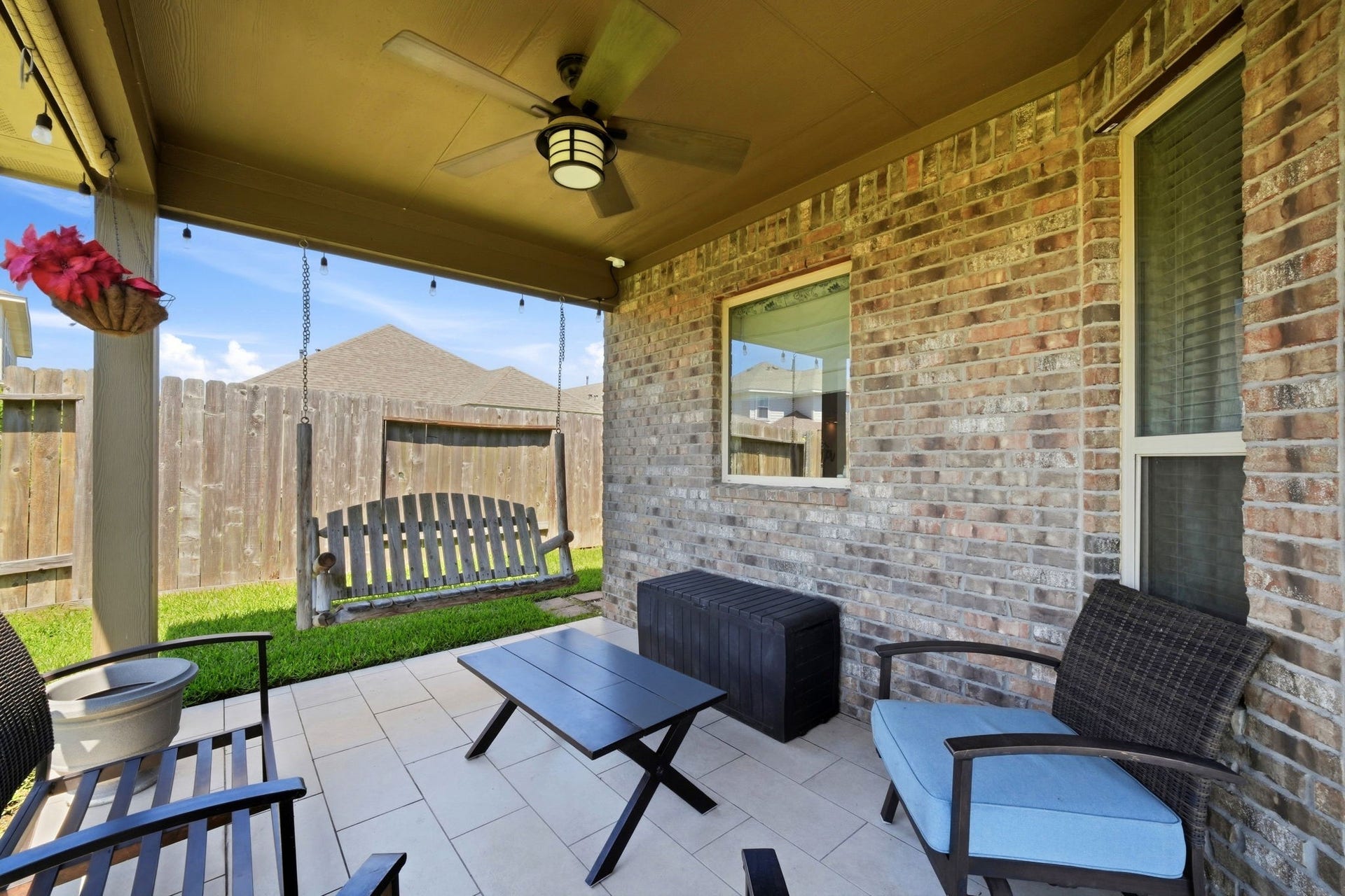 21639 Lexor Drive, Porter, TX 77365 Charming covered patio featuring a ceiling fan perfect for relaxing and enjoying the outdoors.