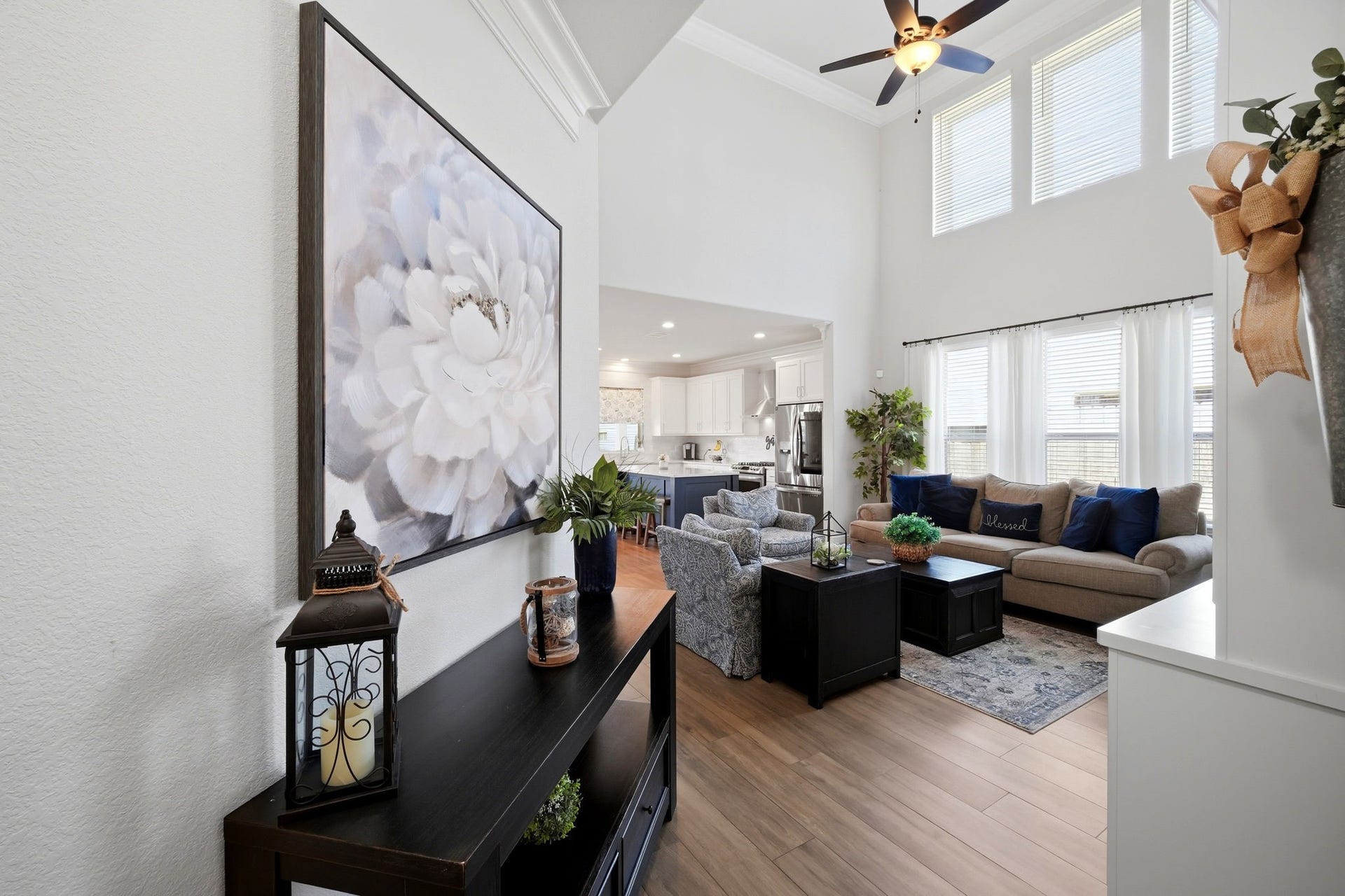 21639 Lexor Drive, Porter, TX 77365 Stunning open-concept living area with soaring ceilings, abundant natural light, and seamlessly flowing into a modern kitchen.