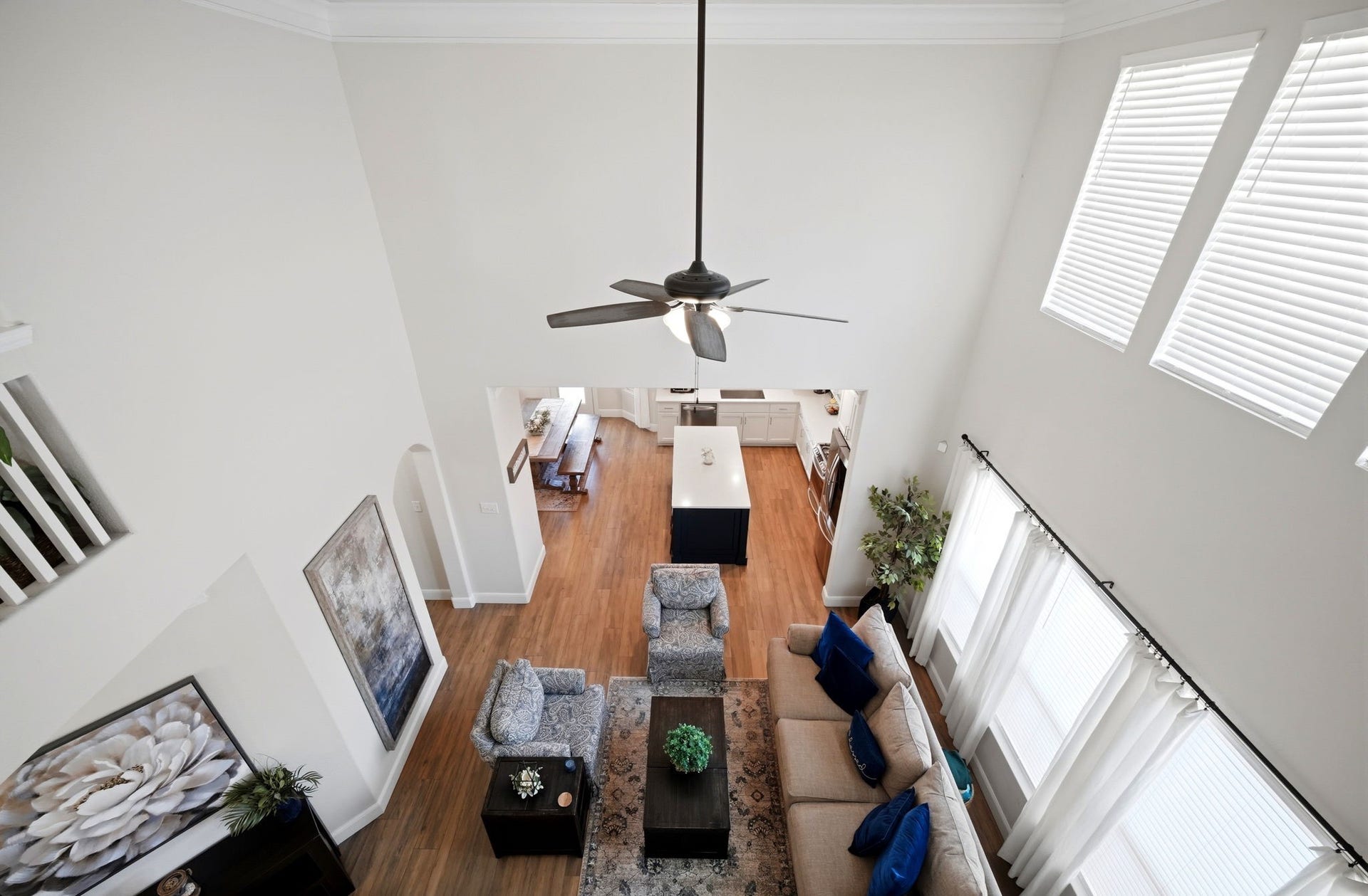 21639 Lexor Drive, Porter, TX 77365 Spacious living area with high ceilings, abundant natural light, and an open view into the modern kitchen, creating an inviting and airy atmosphere.