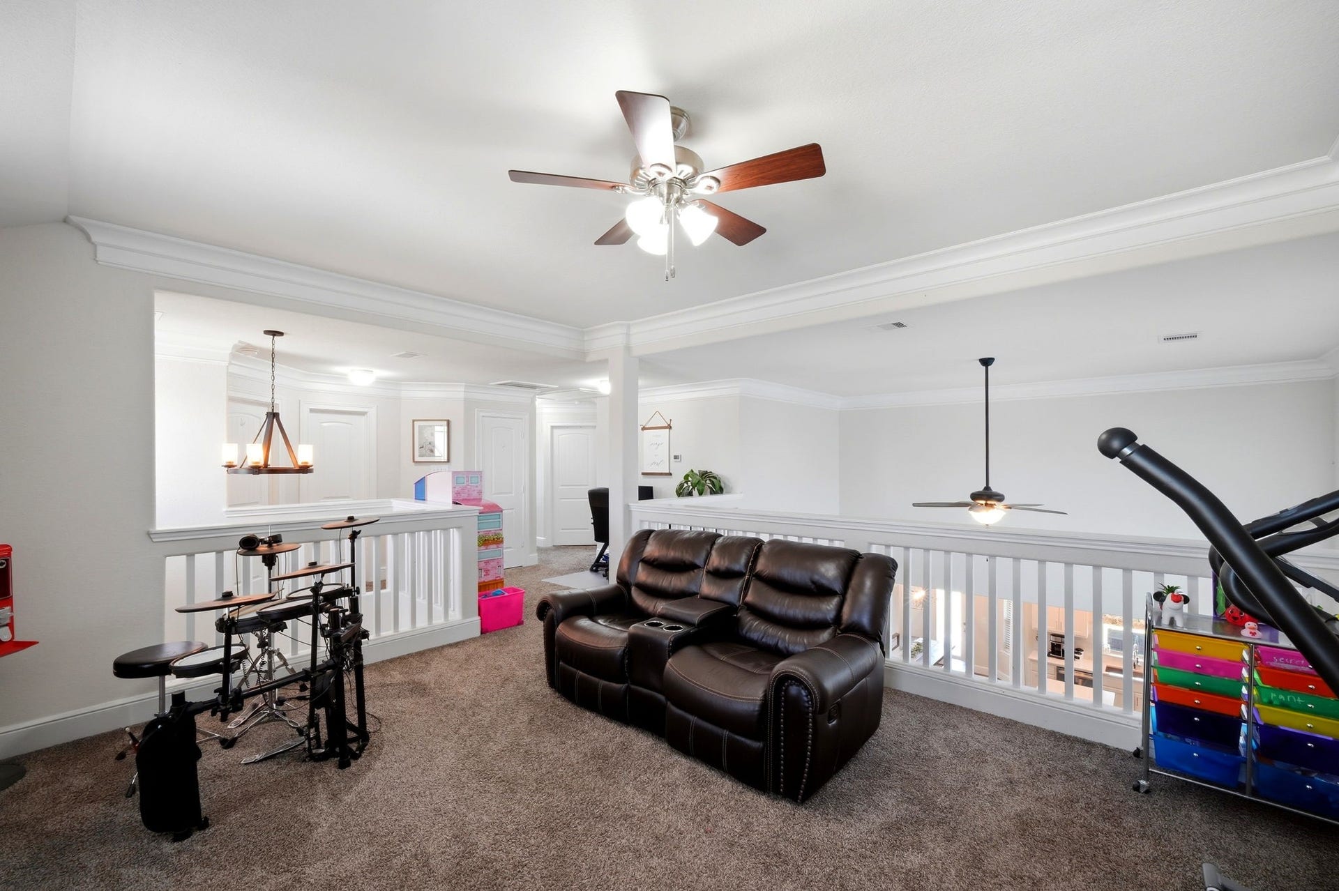 21639 Lexor Drive, Porter, TX 77365 Spacious and versatile loft area featuring plush carpet and ample natural light, perfect for relaxation or entertainment.