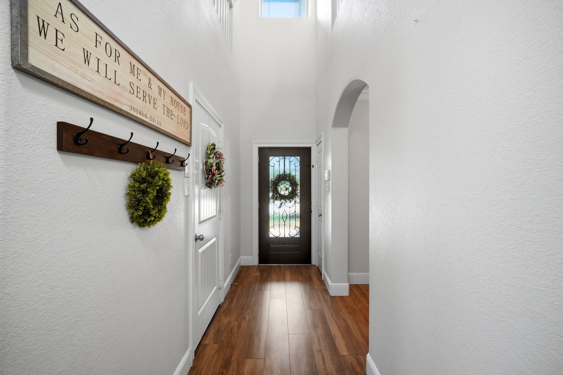 21639 Lexor Drive, Porter, TX 77365 Inviting entryway with warm flooring and a stylish glass-panel front door that allows natural light to flow in.