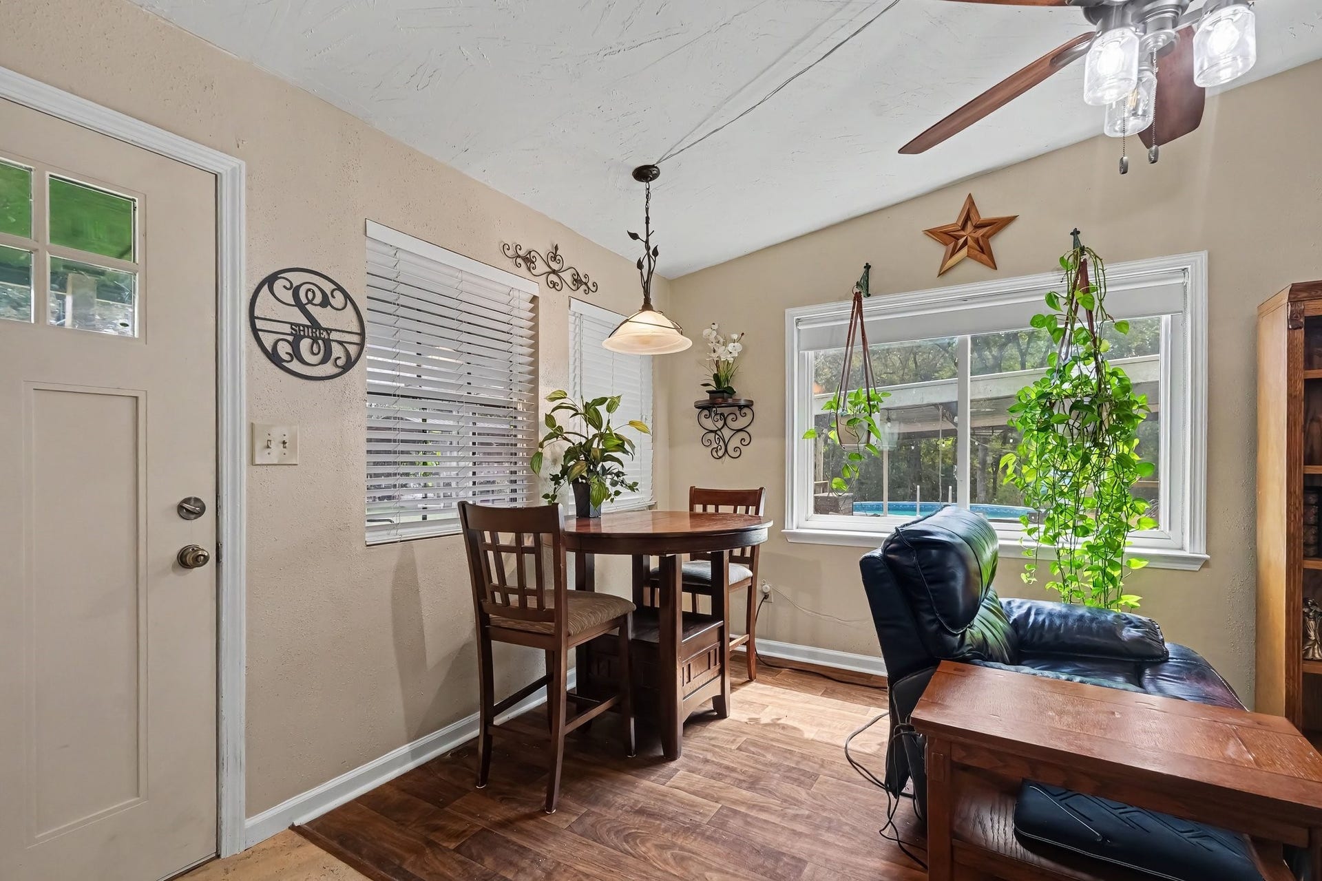 24609 Willow Lane, Hockley, TX 77447 Bright dining area filled with natural light from large windows overlooking the outdoor spaces.