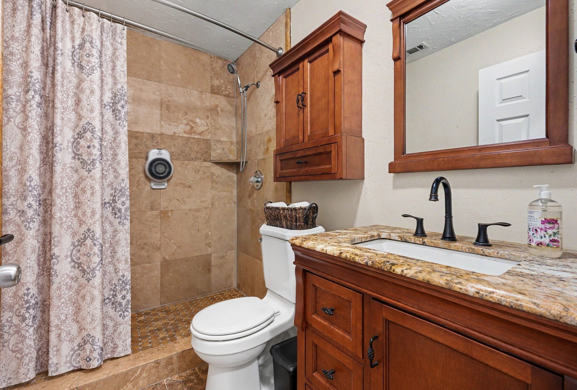 24609 Willow Lane, Hockley, TX 77447 Full secondary bathroom featuring a granite-topped vanity, ample cabinetry, and a tiled shower surround.