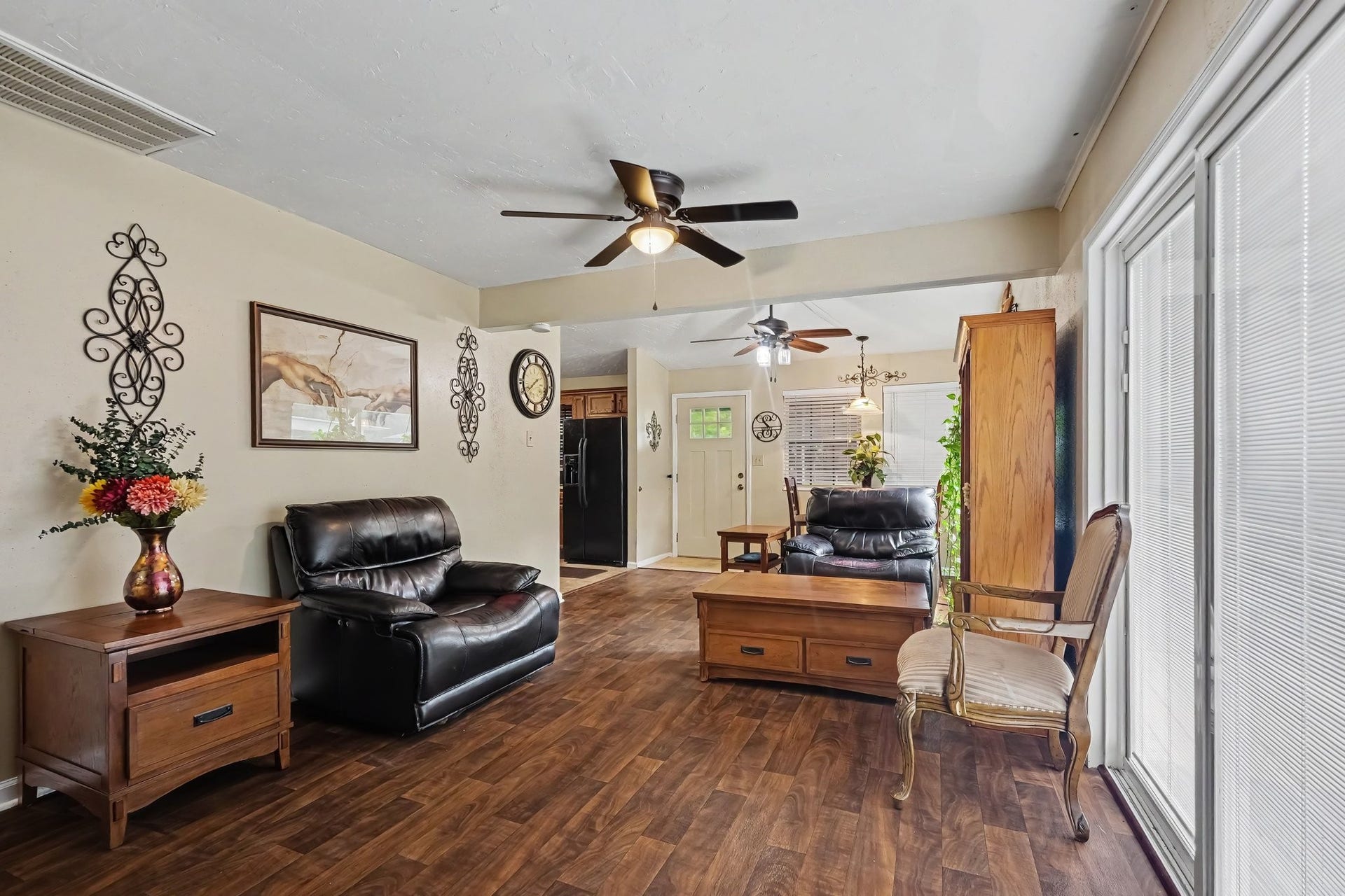 24609 Willow Lane, Hockley, TX 77447 Another view of the generously sized living space featuring large windows, ceiling fans, and plenty of room for comfortable everyday living.