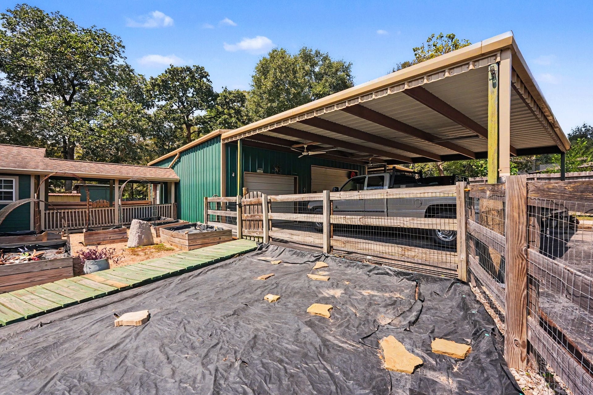 24609 Willow Lane, Hockley, TX 77447 Large detached garage building with an expansive covered parking area, offering plenty of space for vehicles, equipment, or projects.