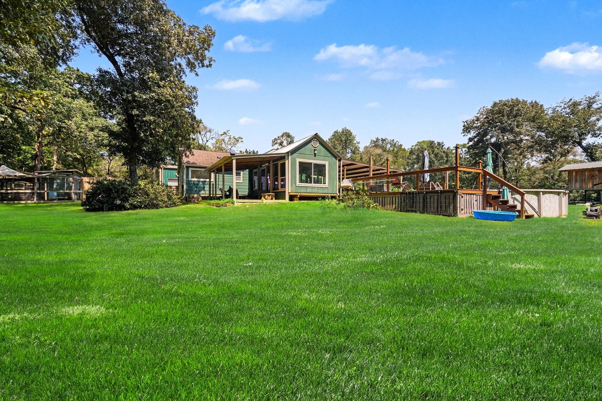 24609 Willow Lane, Hockley, TX 77447 Spacious backyard yard with mature trees and a peaceful, private setting.