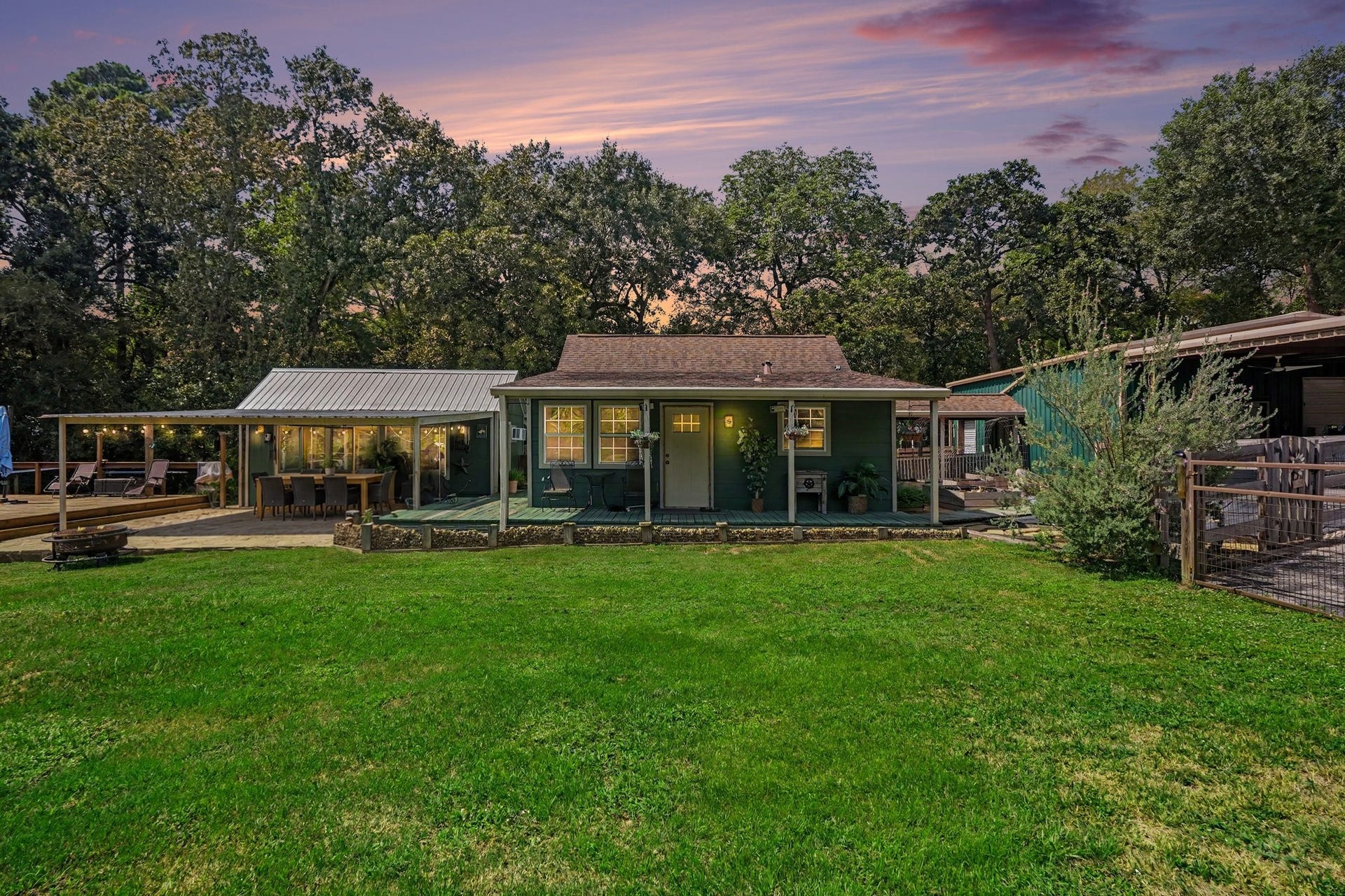 24609 Willow Lane, Hockley, TX 77447 Charming country retreat surrounded by mature trees, featuring an expansive covered porch and outdoor entertaining spaces overlooking the spacious yard. Virtually staged patio furniture.