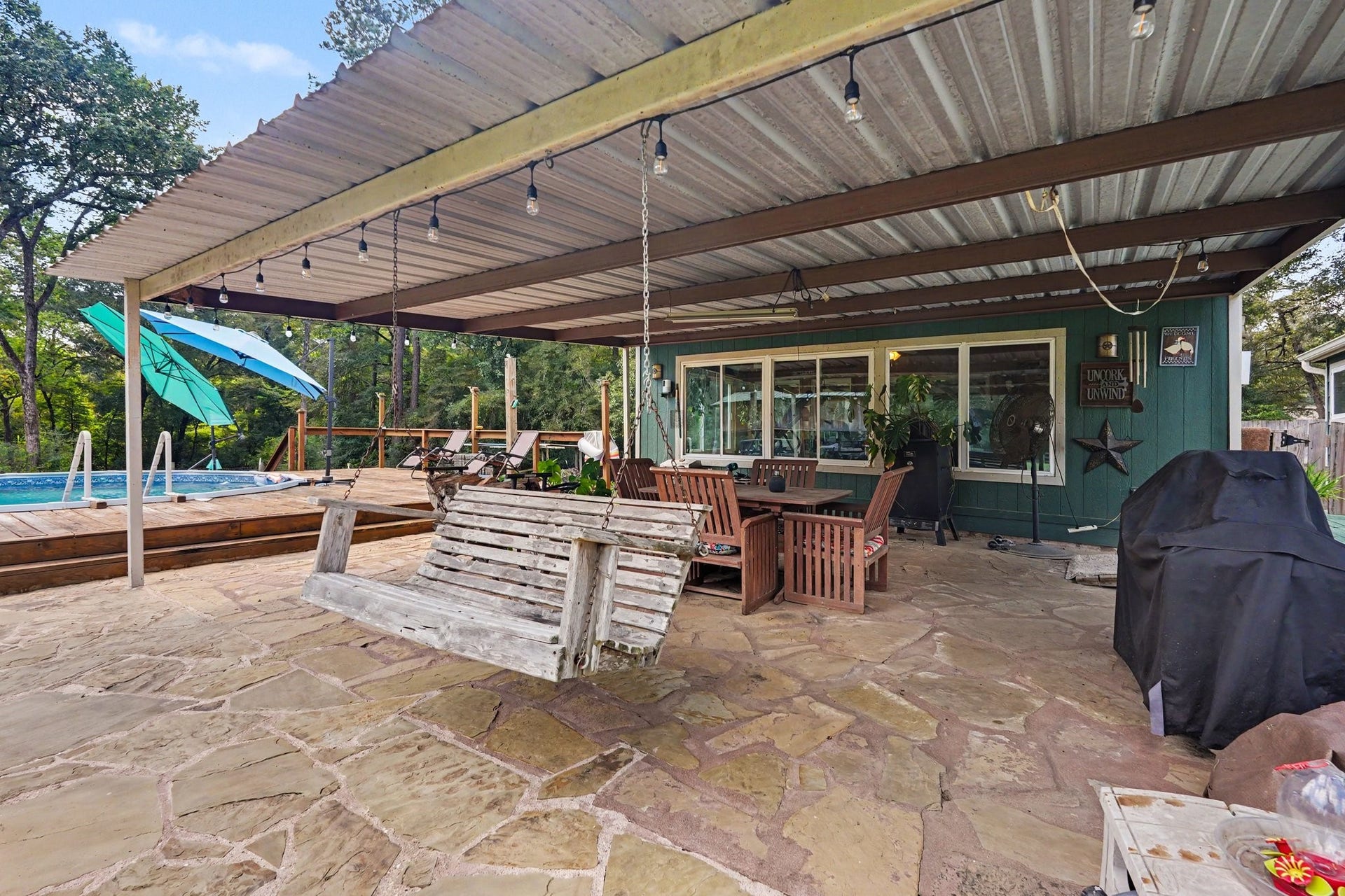 24609 Willow Lane, Hockley, TX 77447 Generous covered outdoor living area with plenty of space for seating, grilling, and enjoying the adjacent pool.