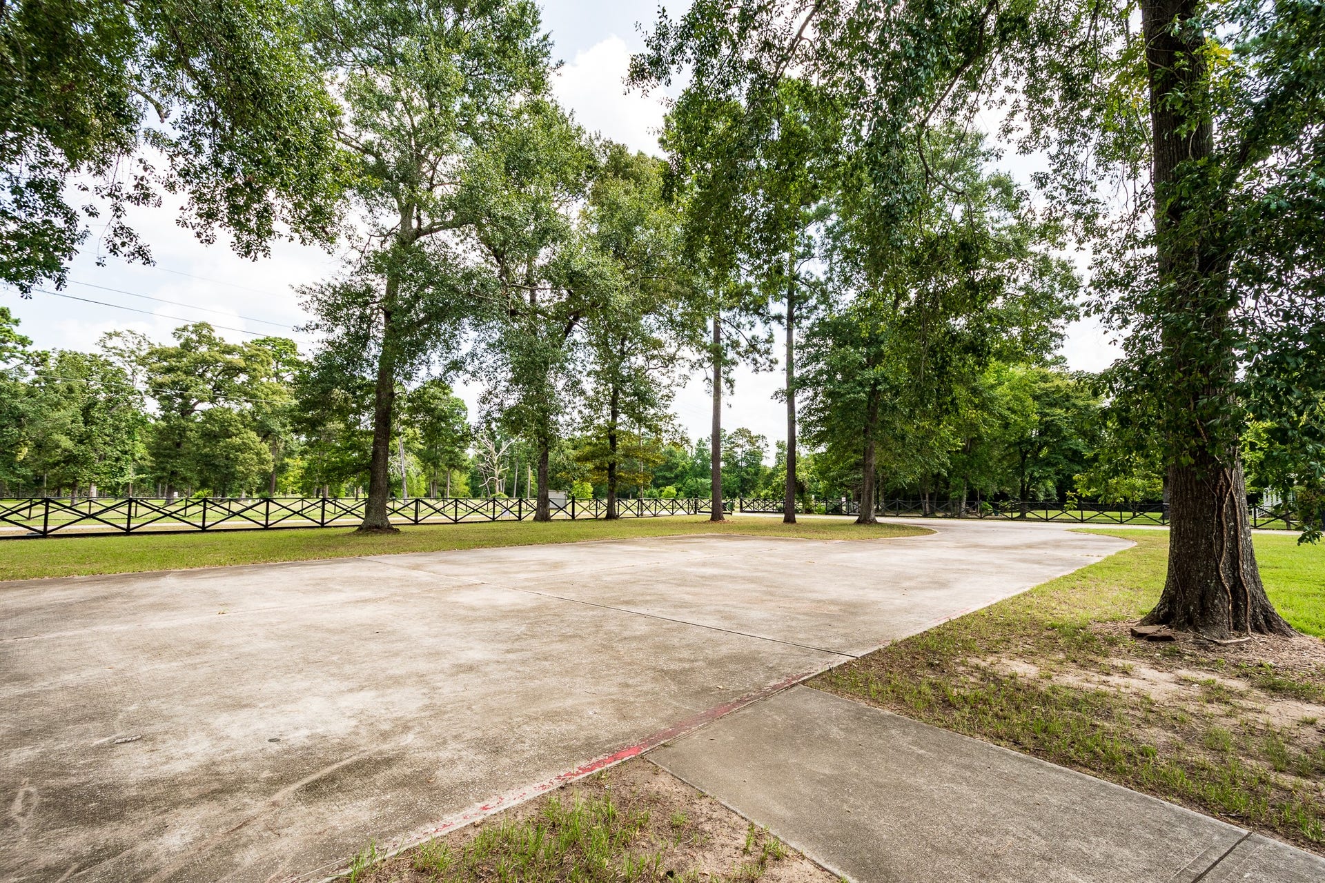 16111 Porter Lane, Porter, TX 77365 Gorgeous fenced lined driveway of building #3.