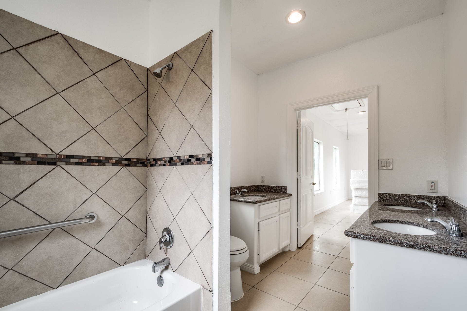 16111 Porter Lane, Porter, TX 77365 Bathroom in building #2 with 3 sinks and tub/shower combination.