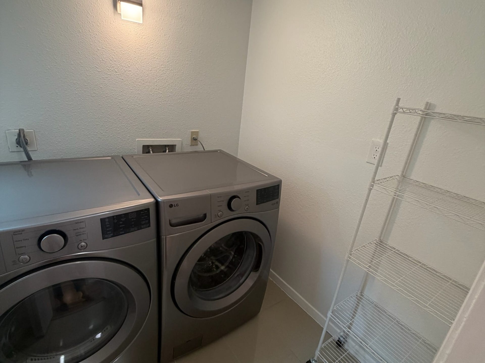 3500 Tangle Brush Drive, #65, The Woodlands, TX 77381 Dedicated in-unit laundry room offers space for a full-size washer and dryer plus additional room for shelving and storage to keep household essentials organized.