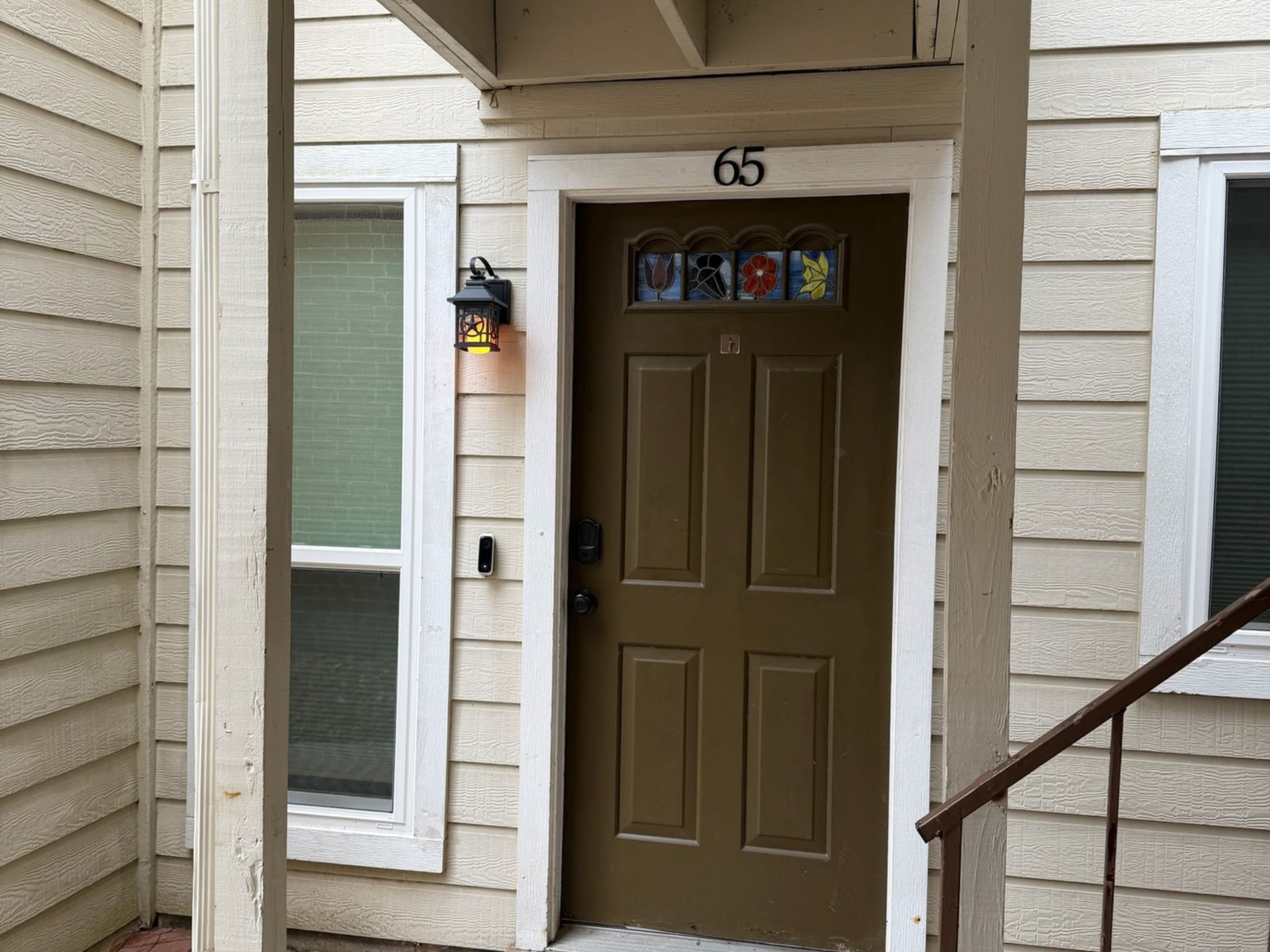 3500 Tangle Brush Drive, #65, The Woodlands, TX 77381 Covered entry to Unit 65 offers a welcoming arrival with a decorative front door, sidelight window, and convenient first-floor access. Front door features a Schlage Encode smart lock.