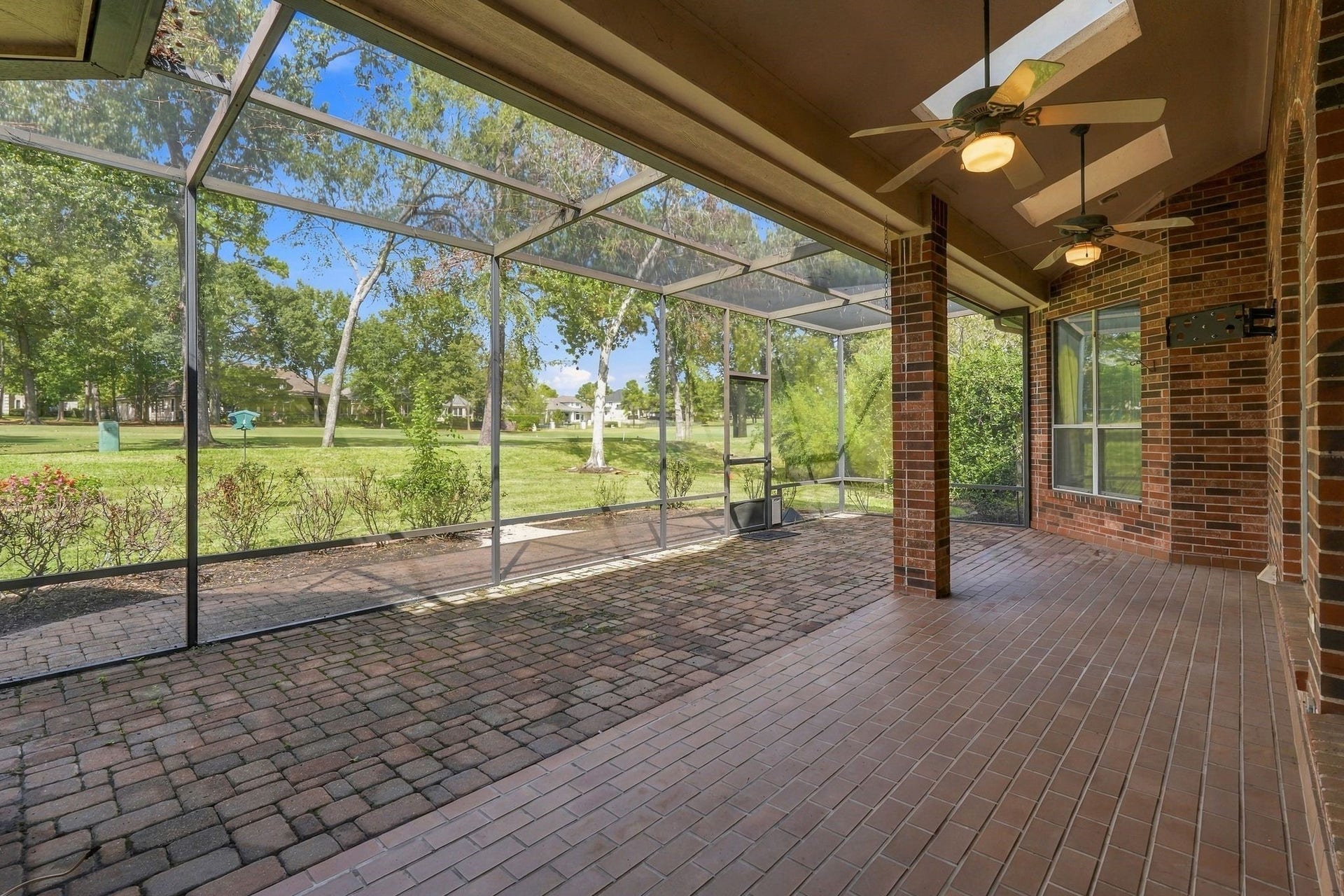 299 Wedgewood Drive, Montgomery, TX 77356 Spacious covered patio and screened-in porch featuring outdoor TV wiring and views of the fairway.