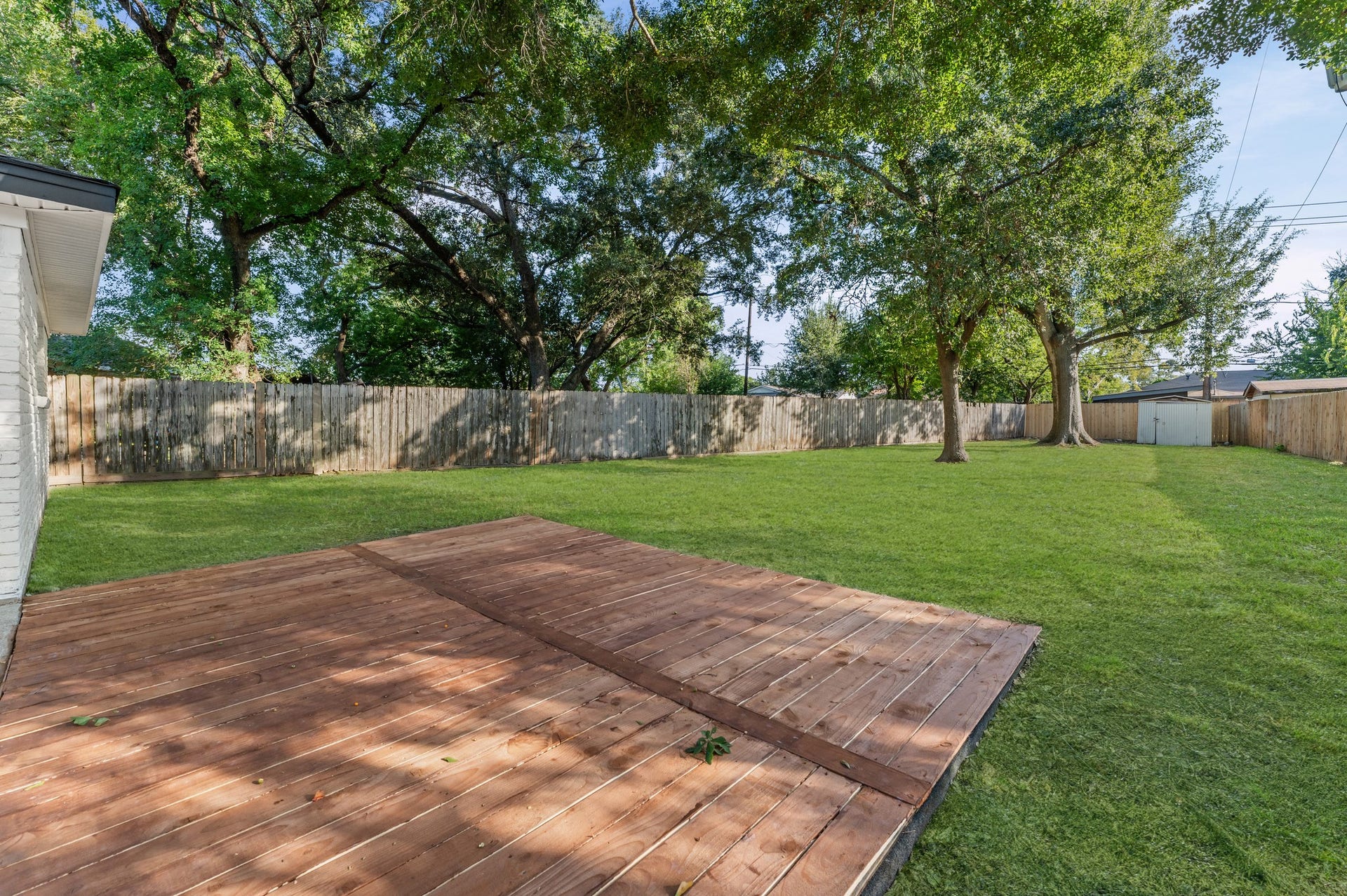 7519 Jason Street, Houston, TX 77074 Beautiful wood deck area walking out of the sliding door.