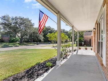 16606 Oxnard Lane, Friendswood, TX 77546 Inviting covered front porch with plenty of space to relax and enjoy the peaceful neighborhood surroundings.