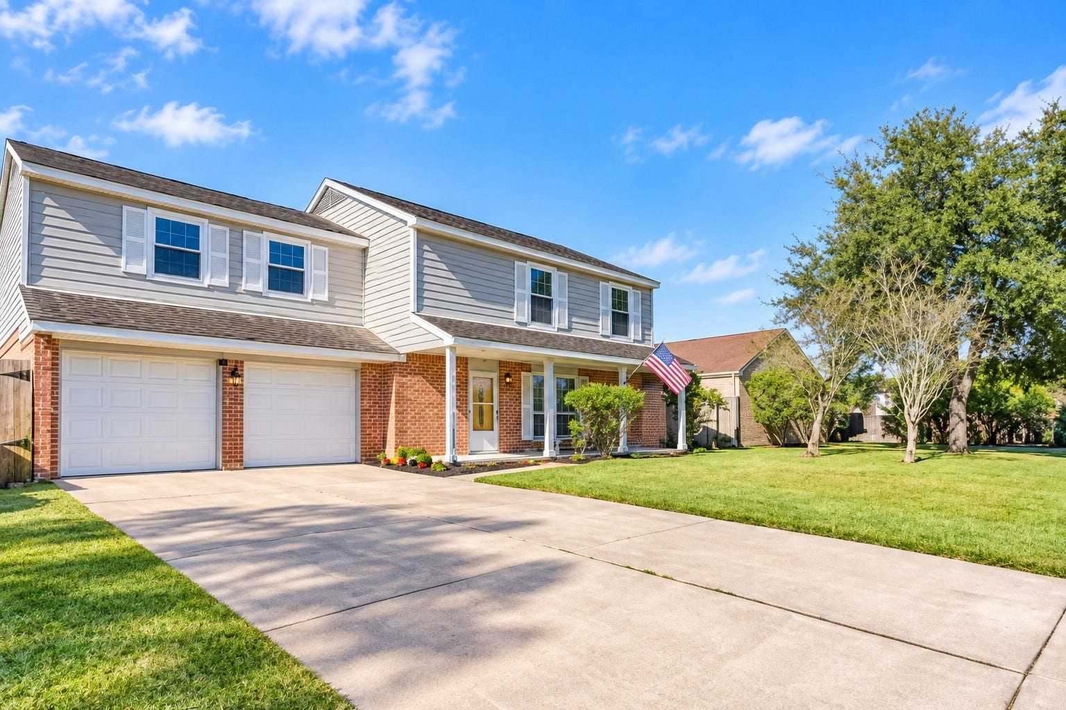 16606 Oxnard Lane, Friendswood, TX 77546 Spacious two story home with ample driveway space and a cozy covered front porch to sit and enjoy your morning coffee and newspaper.