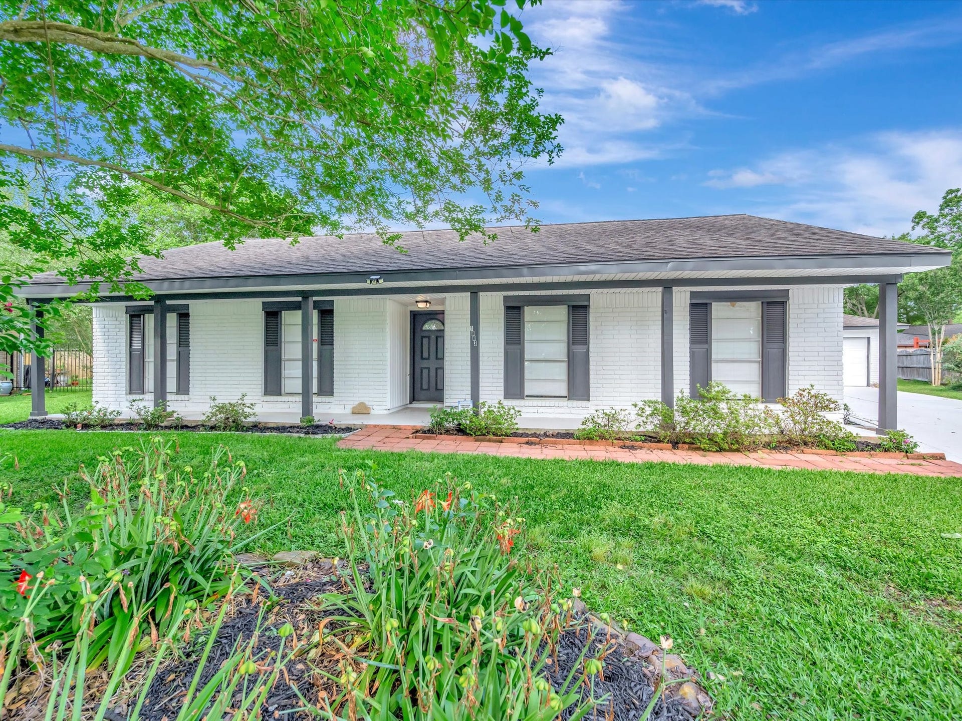 1003 Richvale Lane, Houston, TX 77062 Large front porch, perfect place to begin your day or end it with a glass of wine.