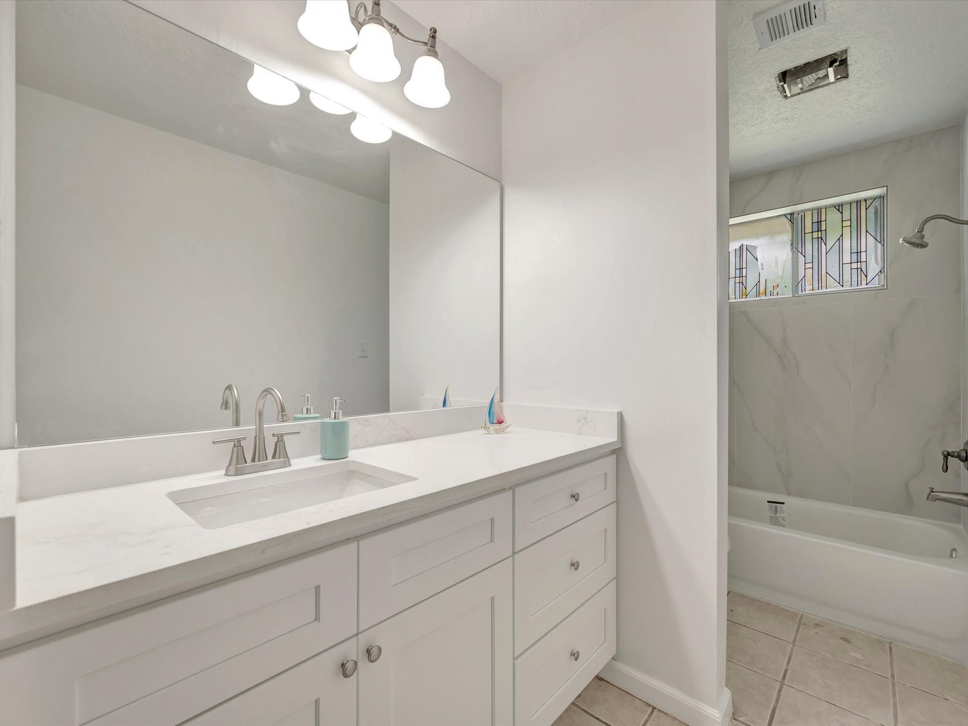 1003 Richvale Lane, Houston, TX 77062 Guest bath with quartz counter top, soft closing drawers and cabinets
