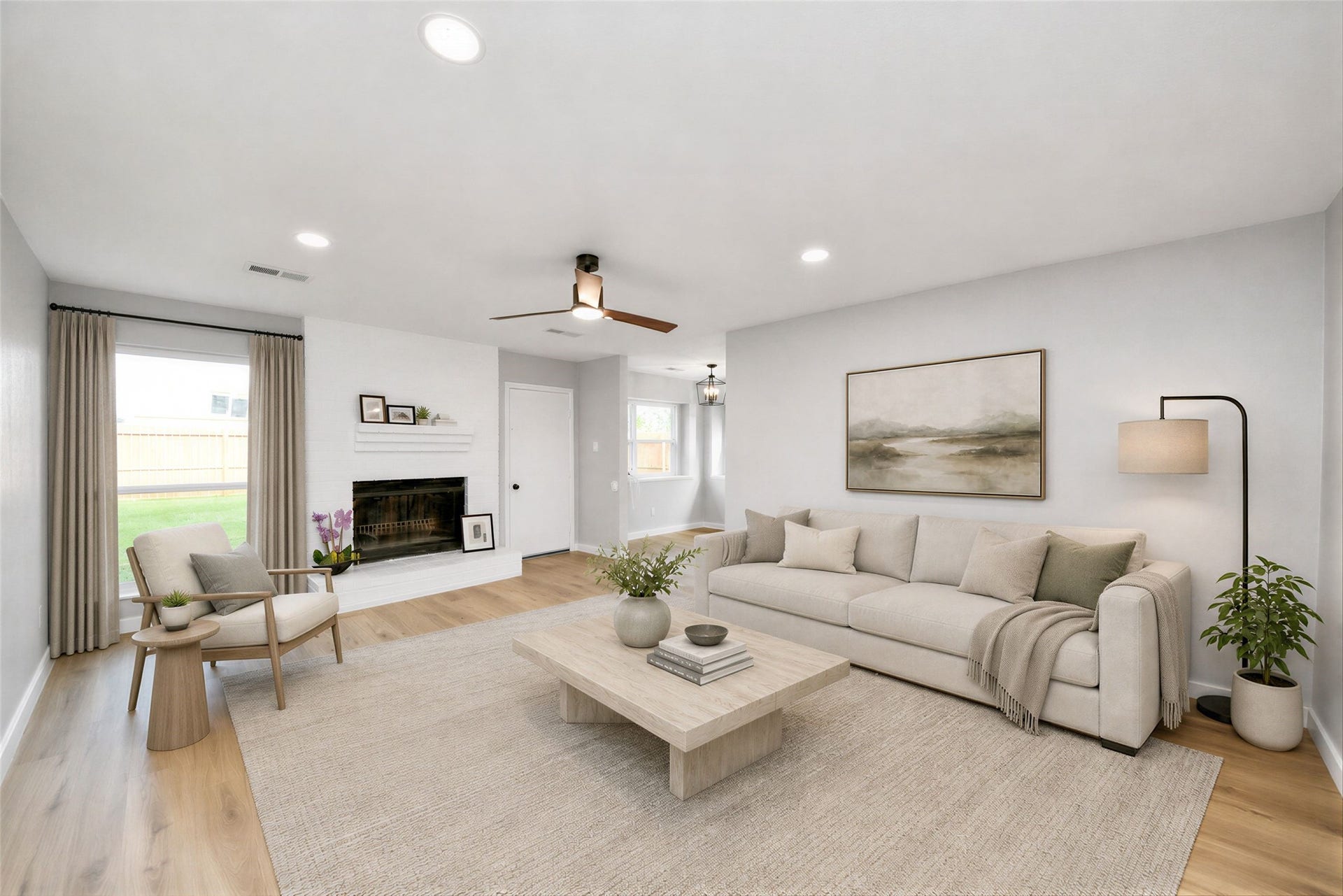 3234 Pebble Lake Drive, Sugar Land, TX 77479 spacious living area features LVP flooring, a modern ceiling fan, and ample natural light from large windows. A cozy fireplace adds charm, and the neutral walls create a versatile backdrop for any decor style. virtually staged.