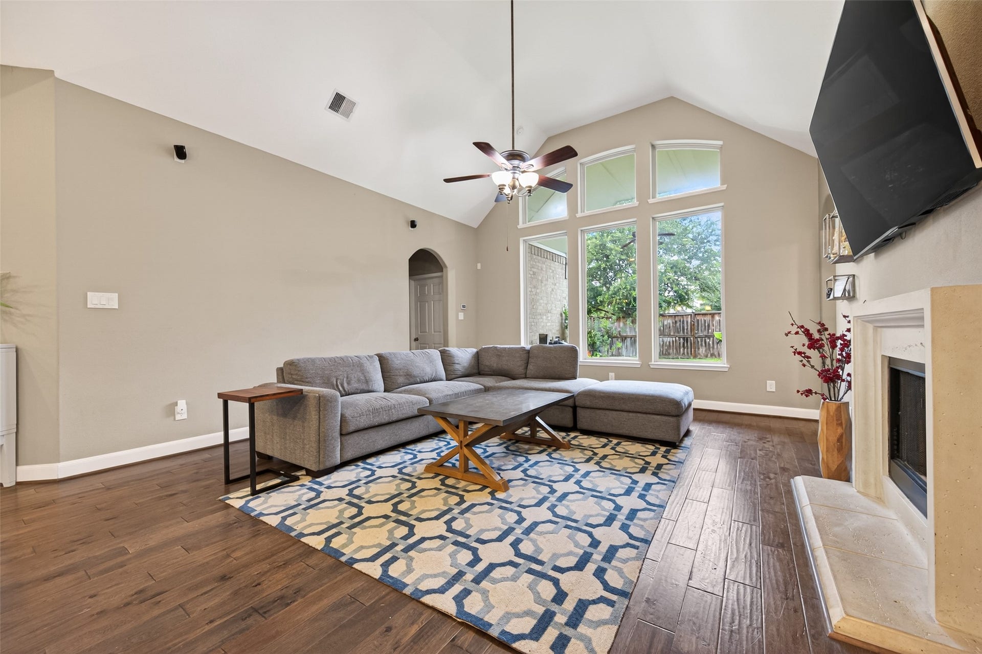 19610 Pecos Bend Court, Cypress, TX 77433 High vaulted ceiling opens up the space welcoming natural light from the tall windows looking out to the covered patio