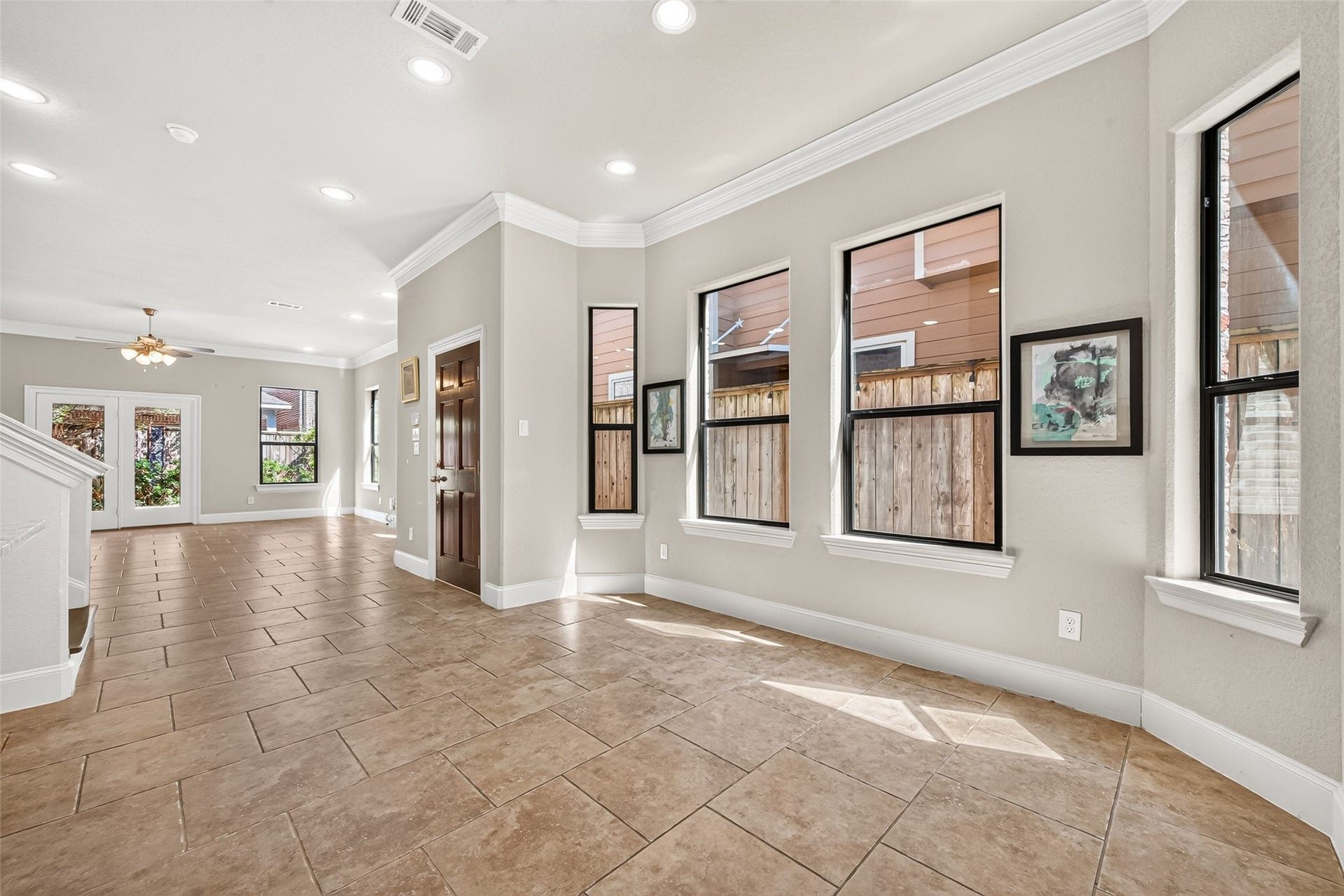 5930 Kiam Street, Houston, TX 77007 Flooded with natural light, this lovely open space and neutral tile flooring greets you (hardwoods on 2nd). Kitchen and Dining areas lie to the left of front door, to the right you'll find the spacious Living Room (+ half bath), with access to a good size, shady, back yard.