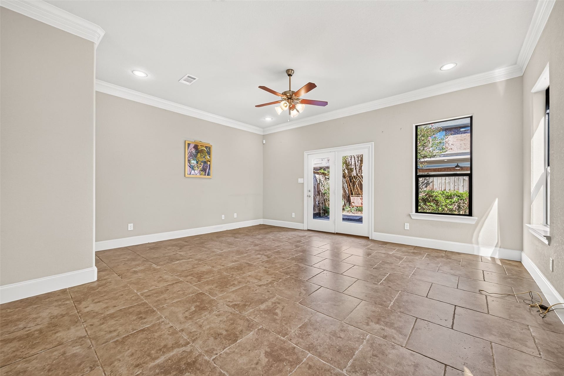 5930 Kiam Street, Houston, TX 77007 Very spacious Living Room offers tons of space for any furniture config. Door ahead leads to Backyard/Patio. To left of photo there's space for an additional table / desk or entryway table/bench if desired.
Out of photo to right of front door is a convenient coat closet.